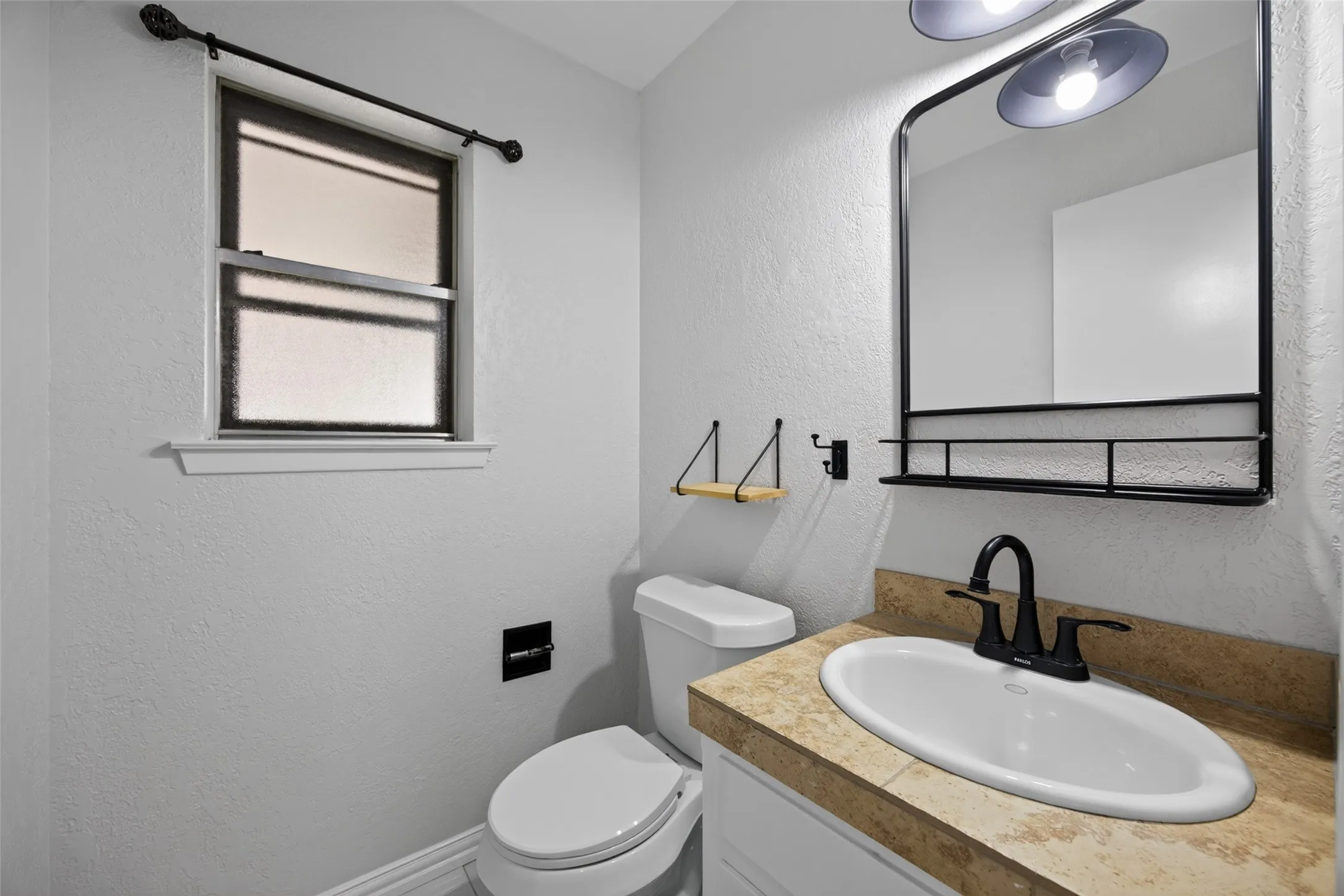 The door to the half bath is in the laundry room