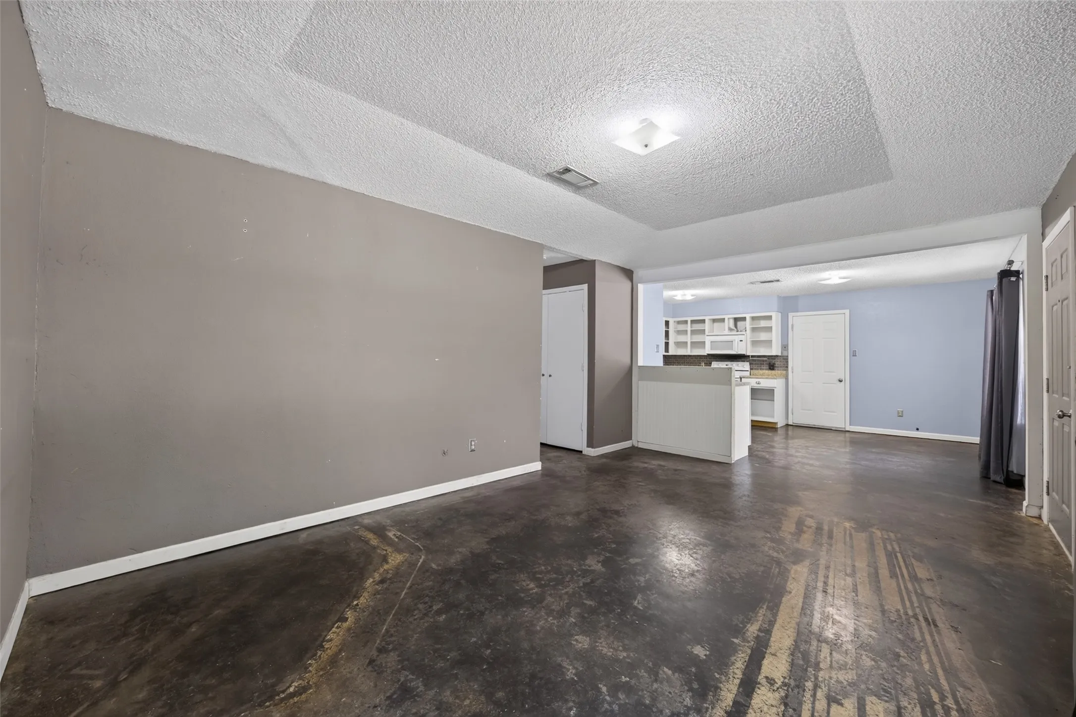 Large living room is open to the kitchen and breakfast room