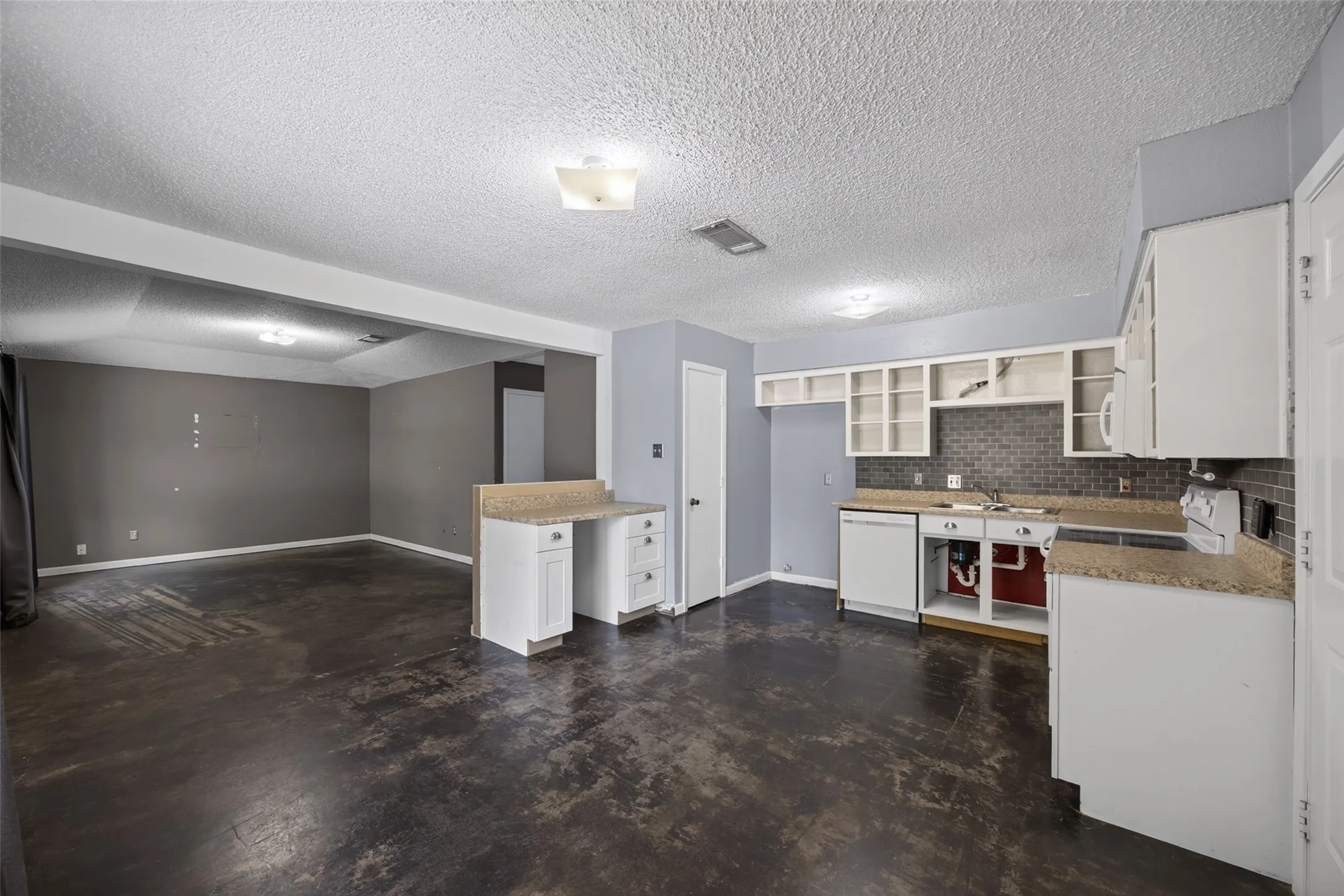 The kitchen and breakfast room are open to the living room
