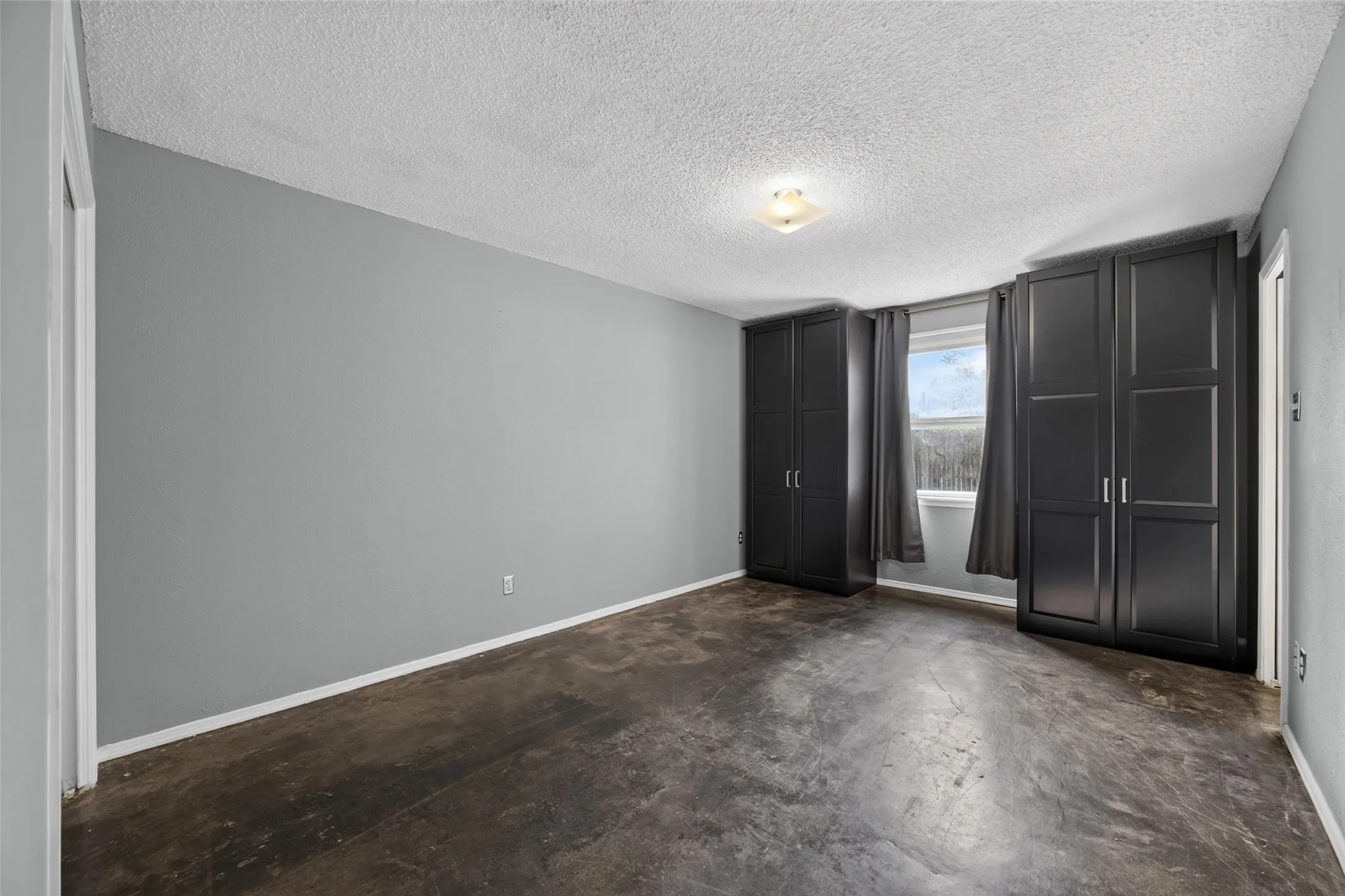 Large primary bedroom with storage that stays