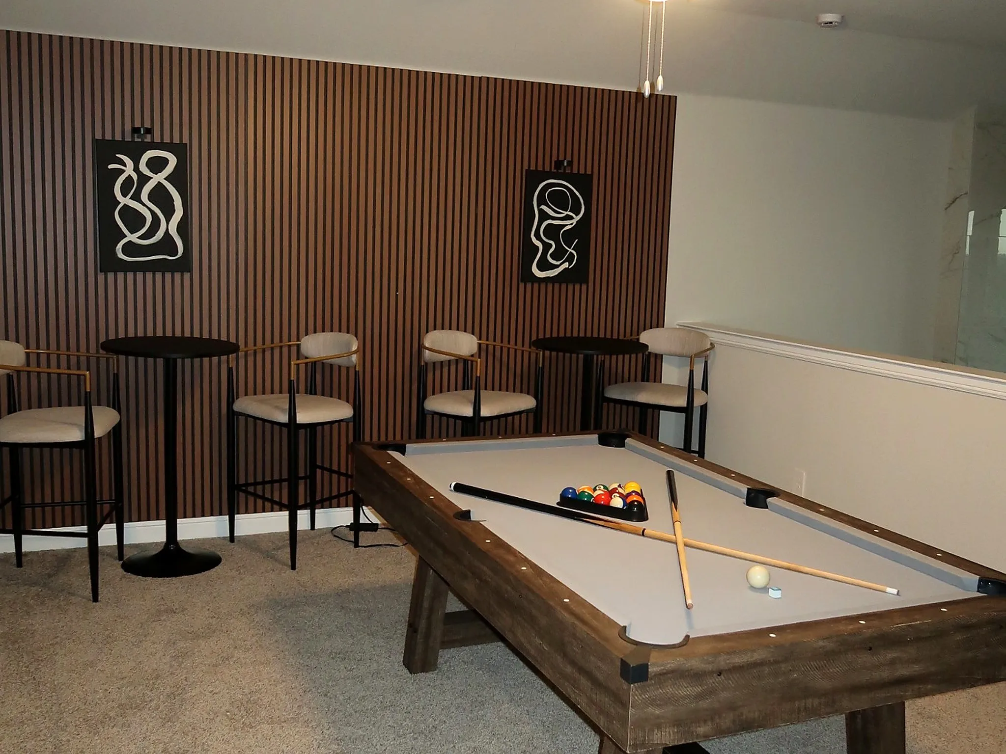 Wood-panel accent wall with recessed lighting