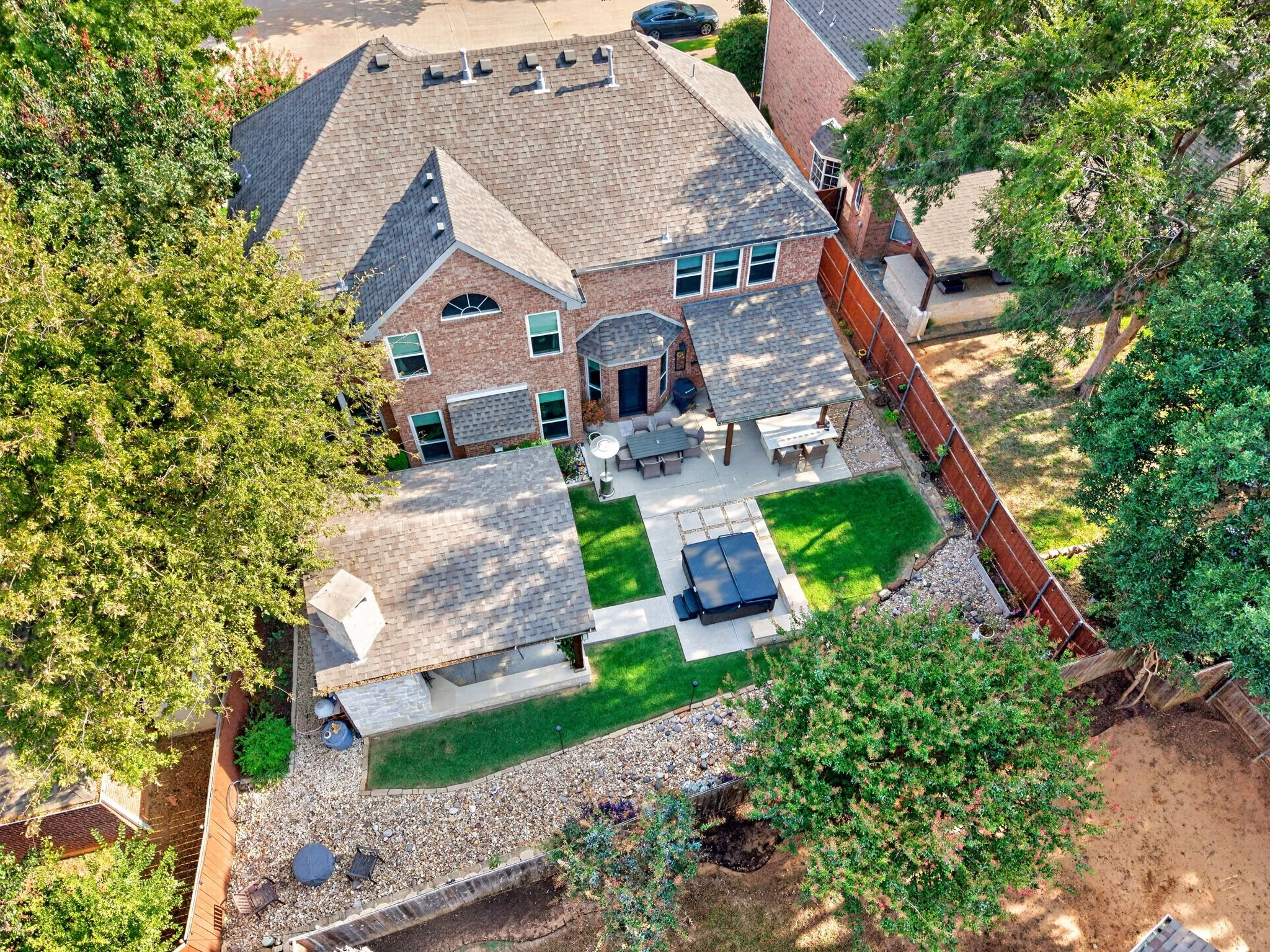 Brick exterior with multiple gables and a shingle roof