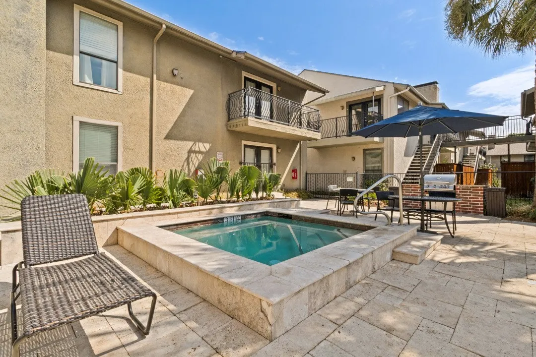 Hot tub & grilling area near pool