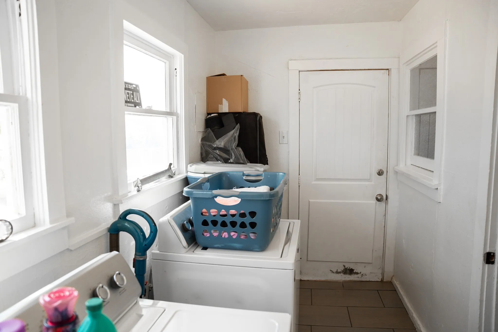 Laundry room off the kitchen. Back door