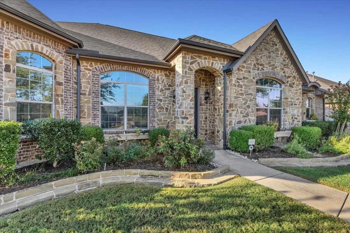 Stone and brick facade with arched entryway