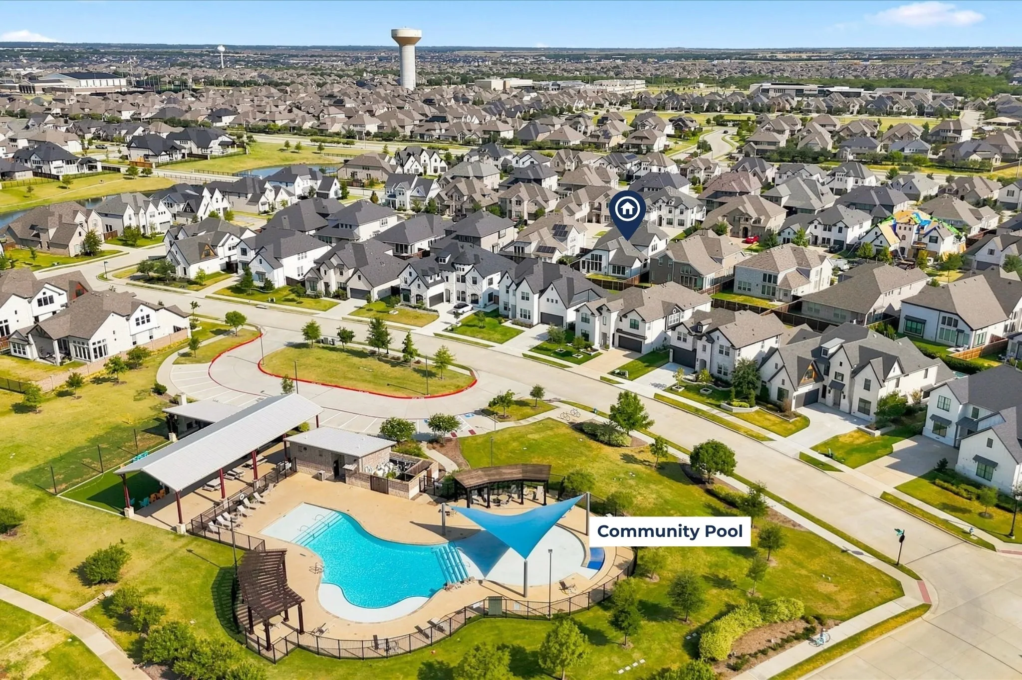 Aerial perspective showcasing a residential community pool proximity from home
