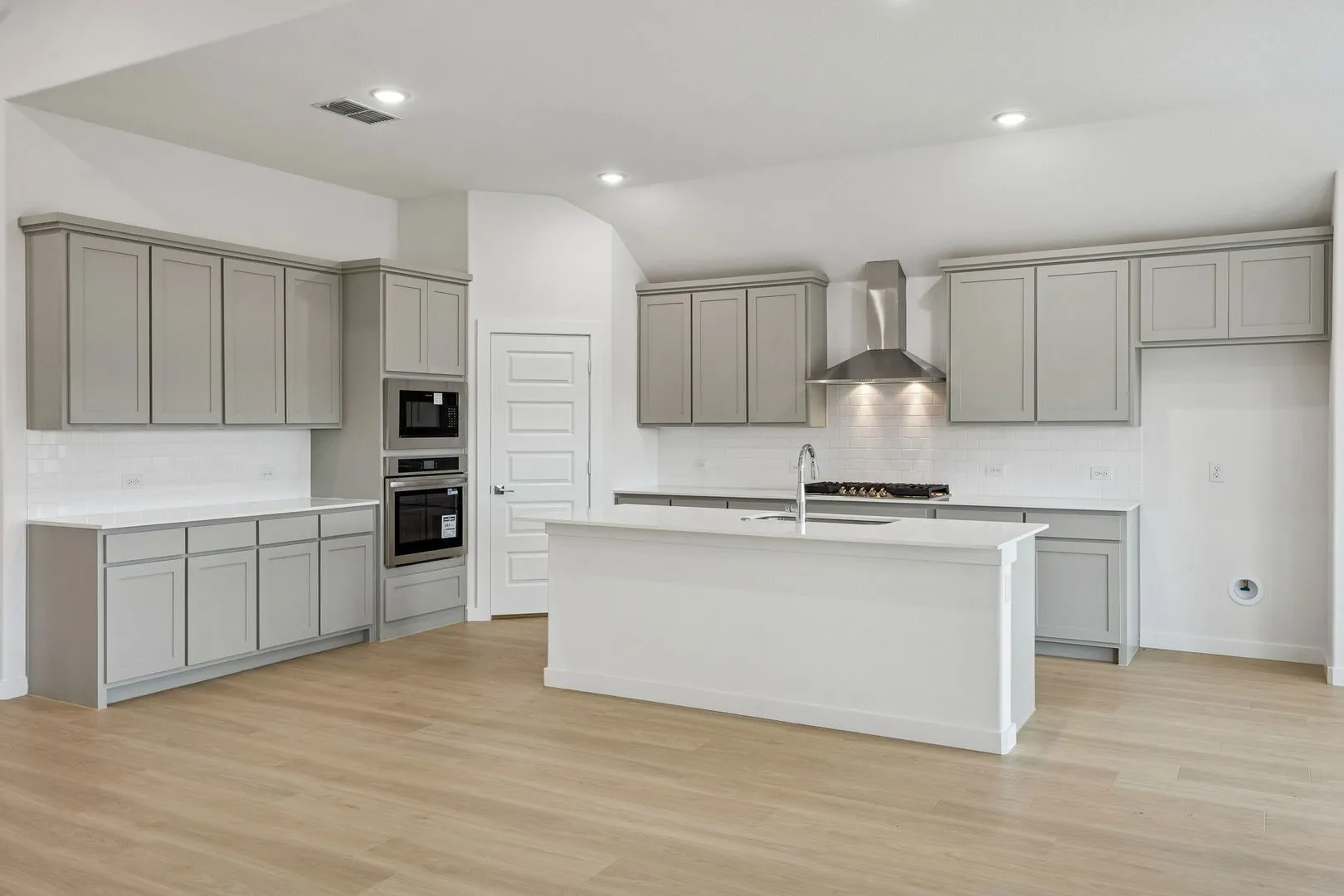 Kitchen in the Gilmour II home plan by Trophy Signature Homes – REPRESENTATIVE PHOTO