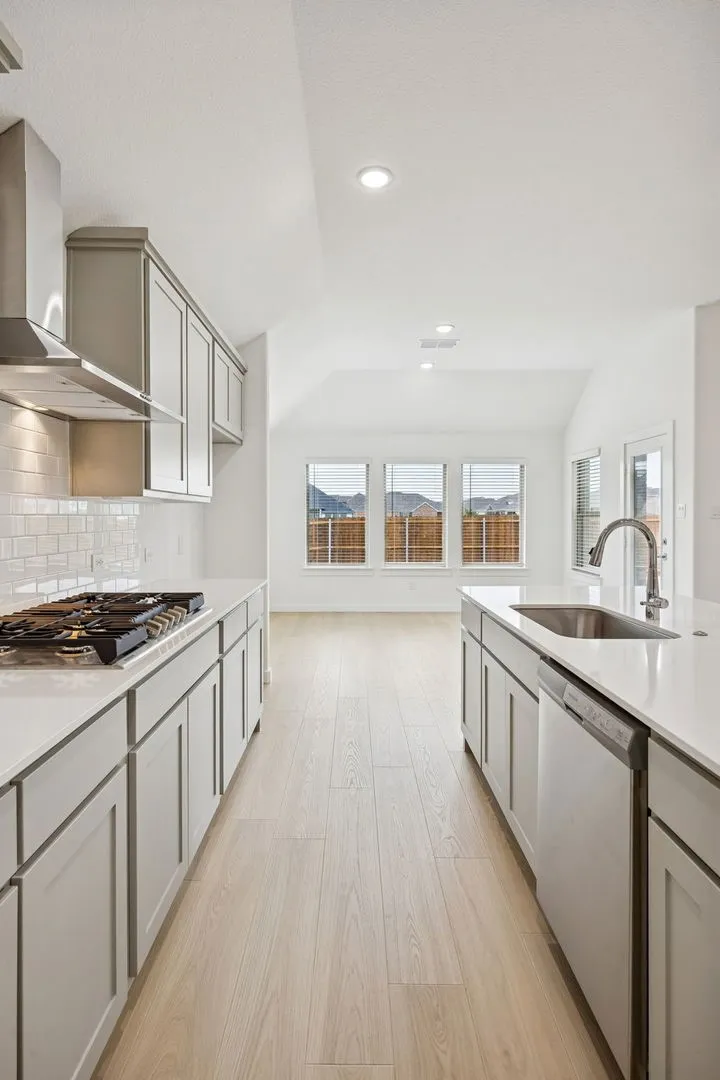 Kitchen in the Gilmour II home plan by Trophy Signature Homes – REPRESENTATIVE PHOTO