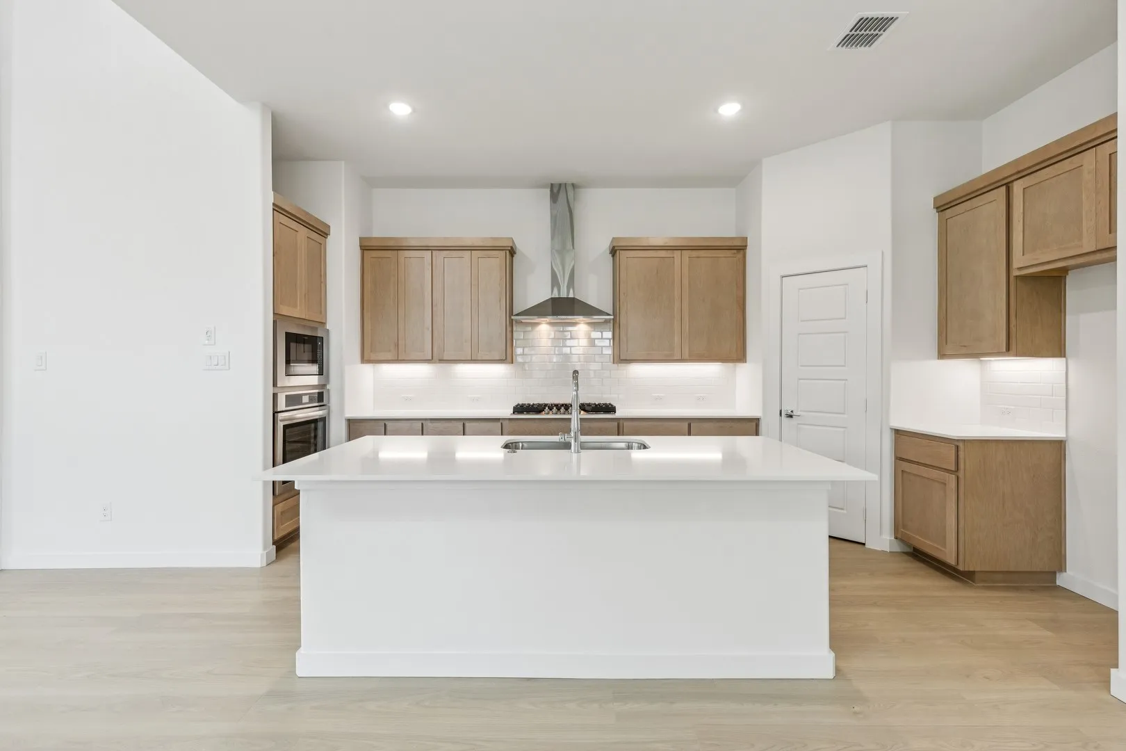 Kitchen in the Da Vinci II home plan by Trophy Signature Homes – REPRESENTATIVE PHOTO