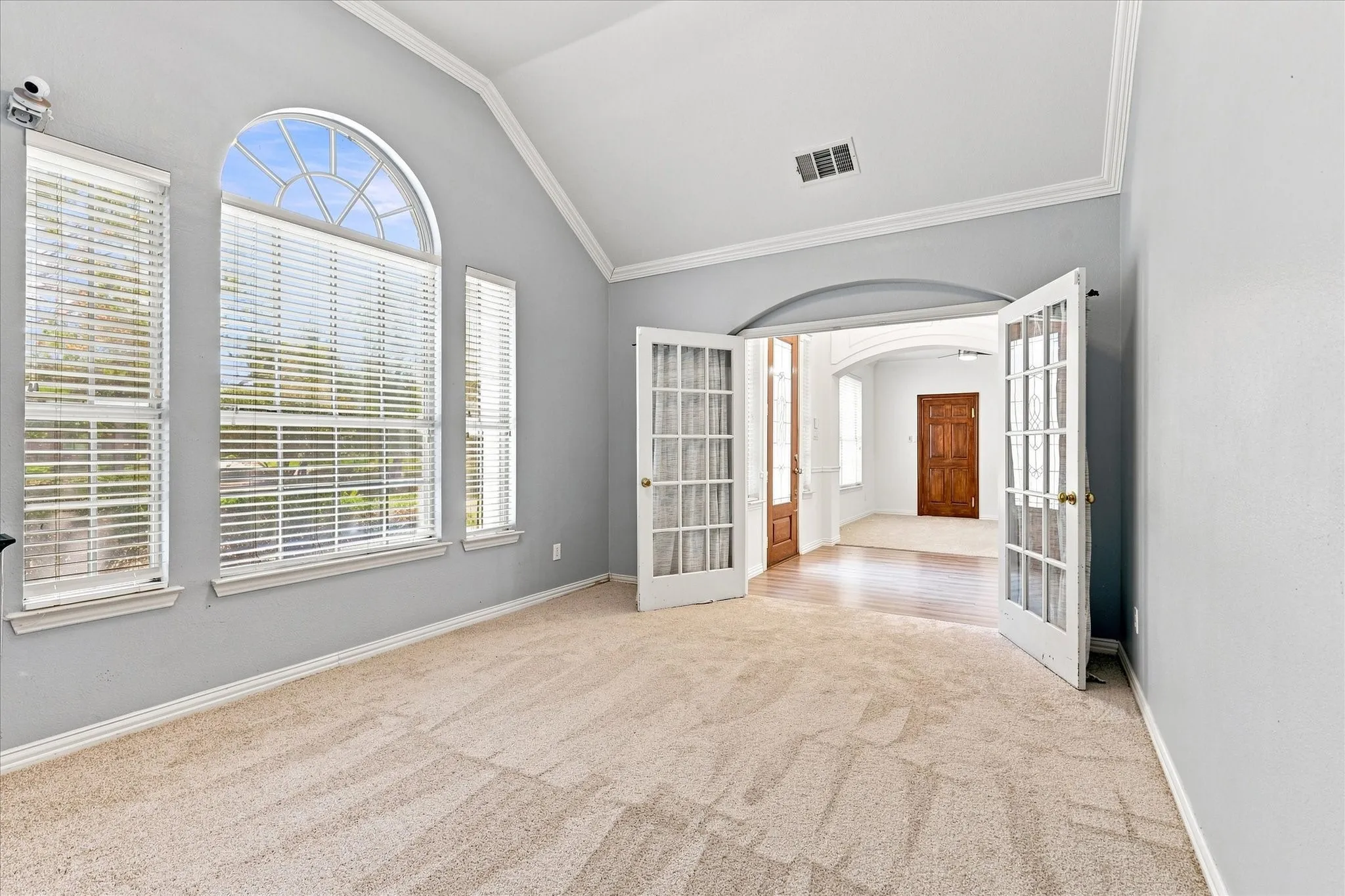 Den or study with french doors and new carpet