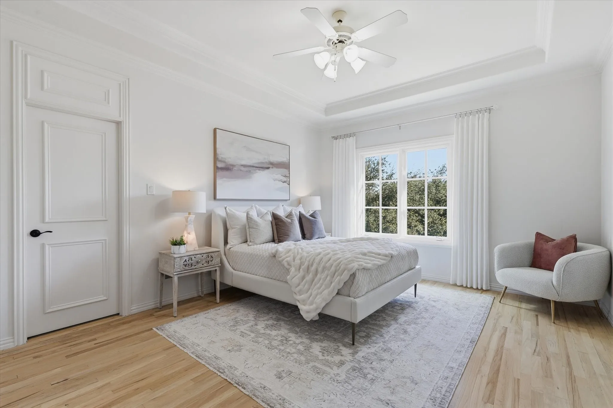 One of three spacious upstairs bedrooms offers a private ensuite bath and walk-in closet.