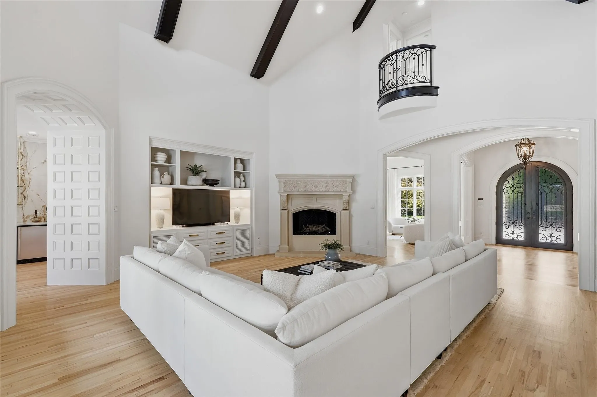 Refinished hardwood floors connect the family room to the kitchen, entry and surrounding living spaces.