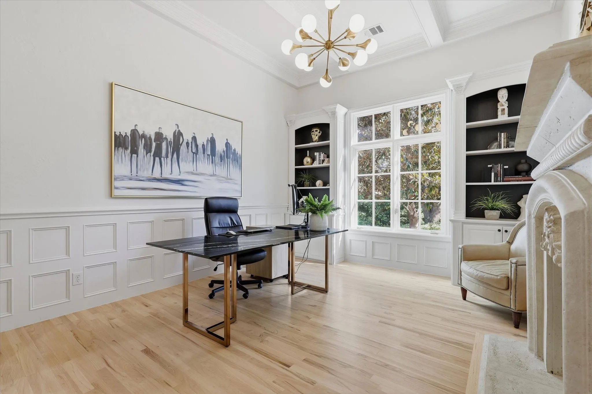 The private study is distinguished by custom built-ins, rich millwork and abundant natural light.