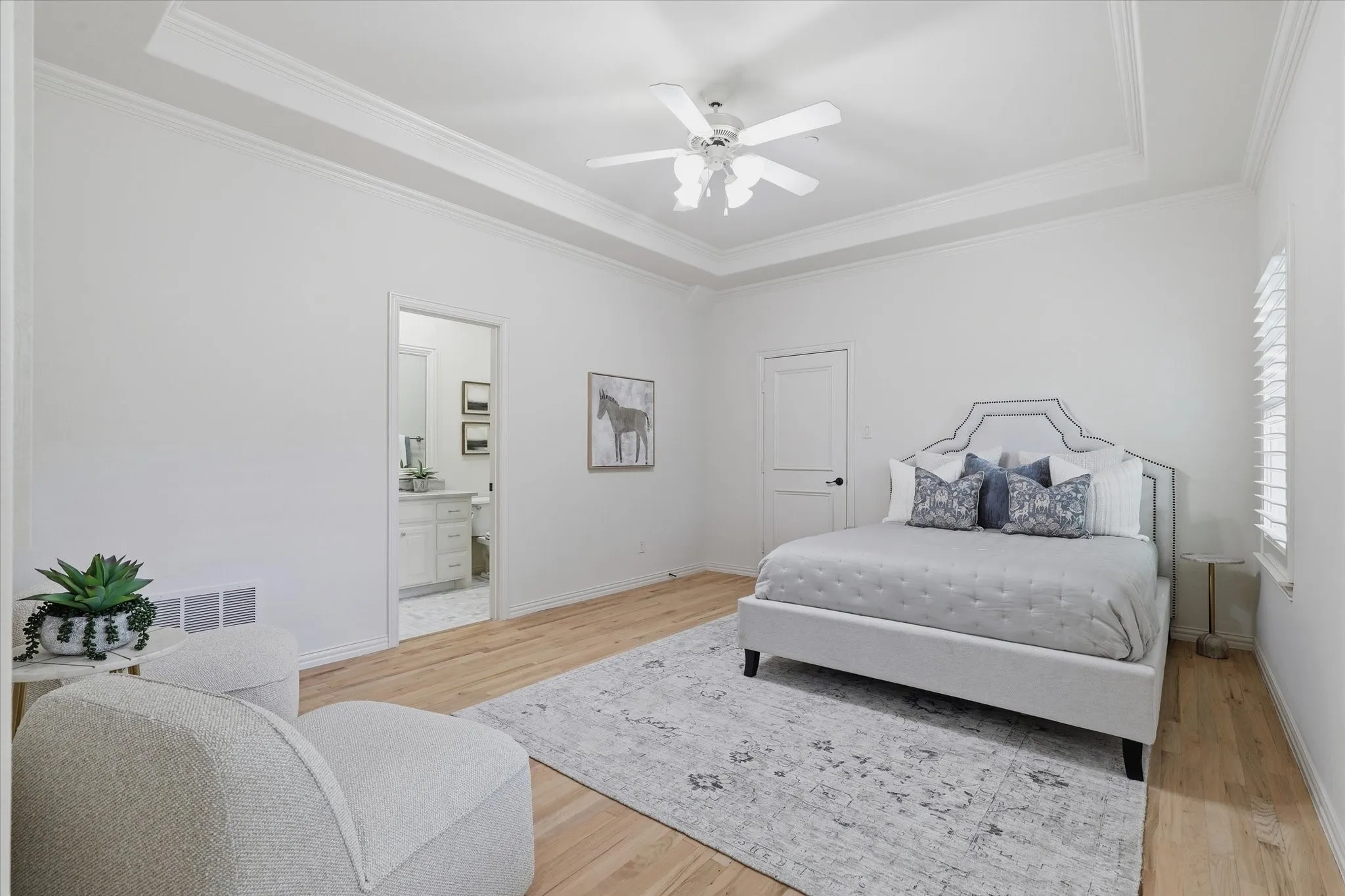 The third upstairs bedroom is generously sized and includes its own private bath and walk-in closet.