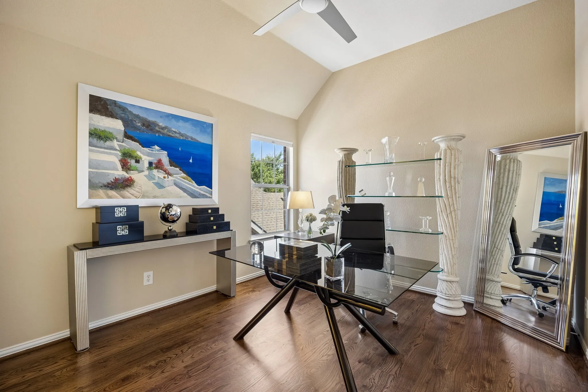 This versatile upstairs bedroom features solid hardwood floors, designer paint color, Jack and Jill bathroom access, and a vaulted ceiling.  It offers flexibility as a private office or a secondary bedroom.
