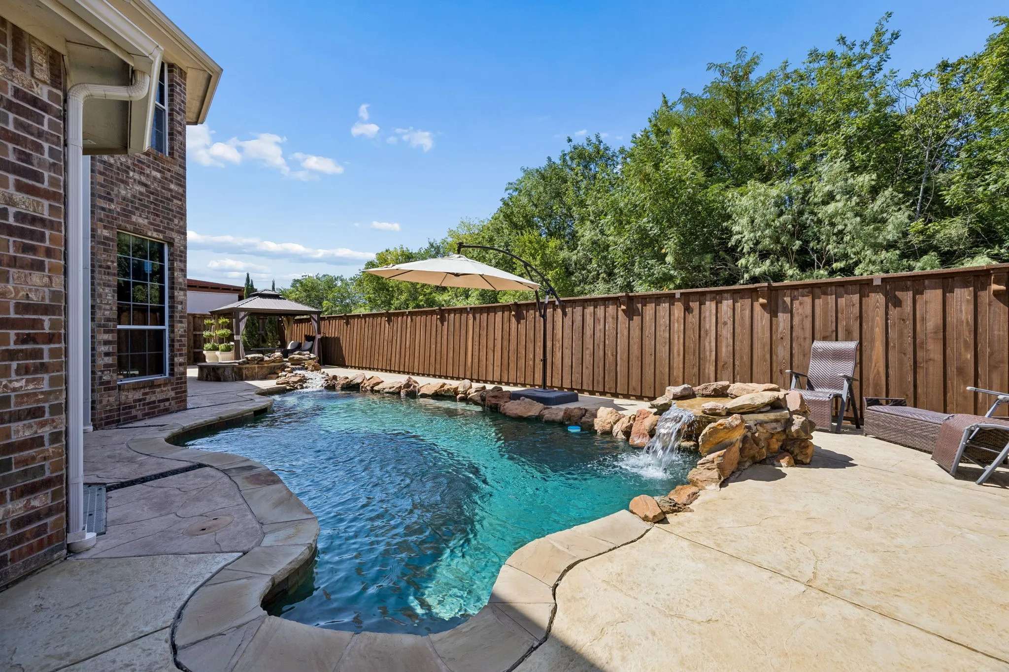 Thoughtfully designed backyard oasis with no detail overlooked:  sparking pool and spa, covered cabana, expansive deck, multiple areas to sit, relax and entertain, plus peaceful Greenbelt with no home directly behind.
