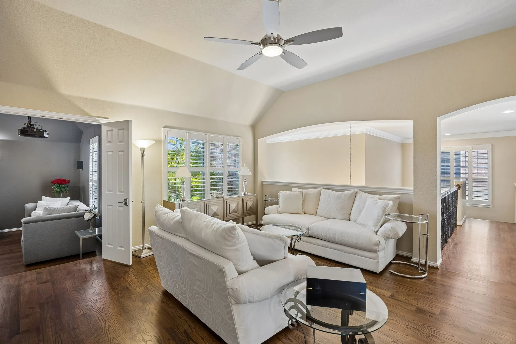 Positioned just off the catwalk, this spacious living area provides convenient access to the media room and three secondary bedrooms, creating a well-designed upper level for family and guests.
