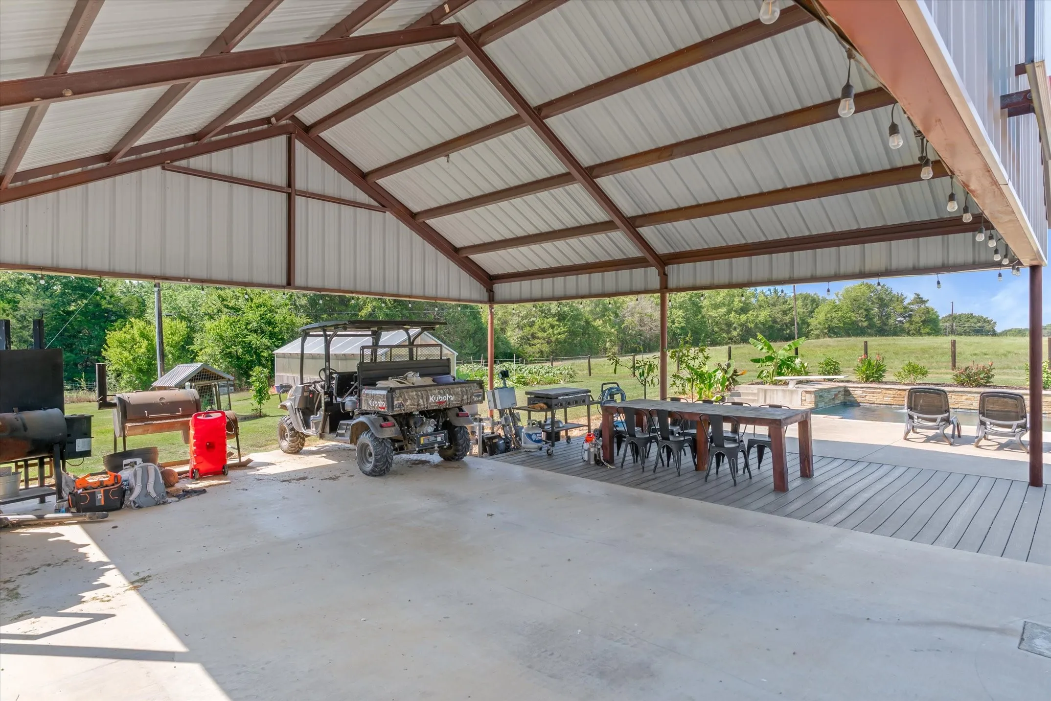 Pavilion for parking or gatherings, resin deck area is covered for outdoor meals