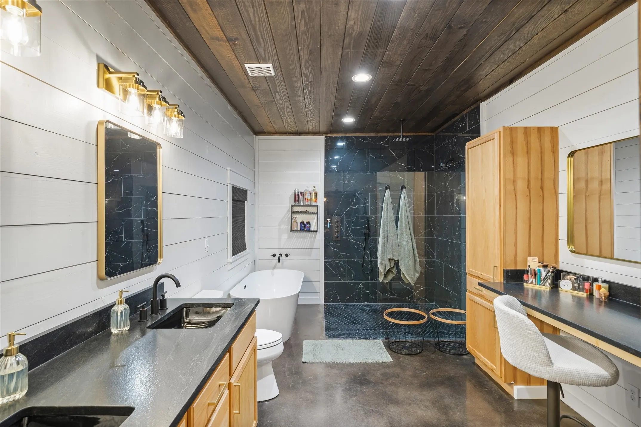 Primary bath is a luxury all its own with a soaker tub and tiled shower with 3 shower heads with each having their own set heat controls. Vanity
