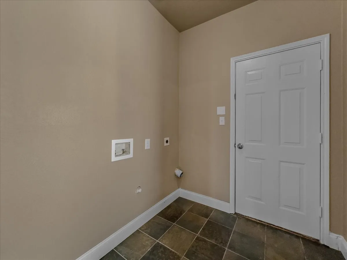 Neutral-toned walls complement the multi-tone tile flooring