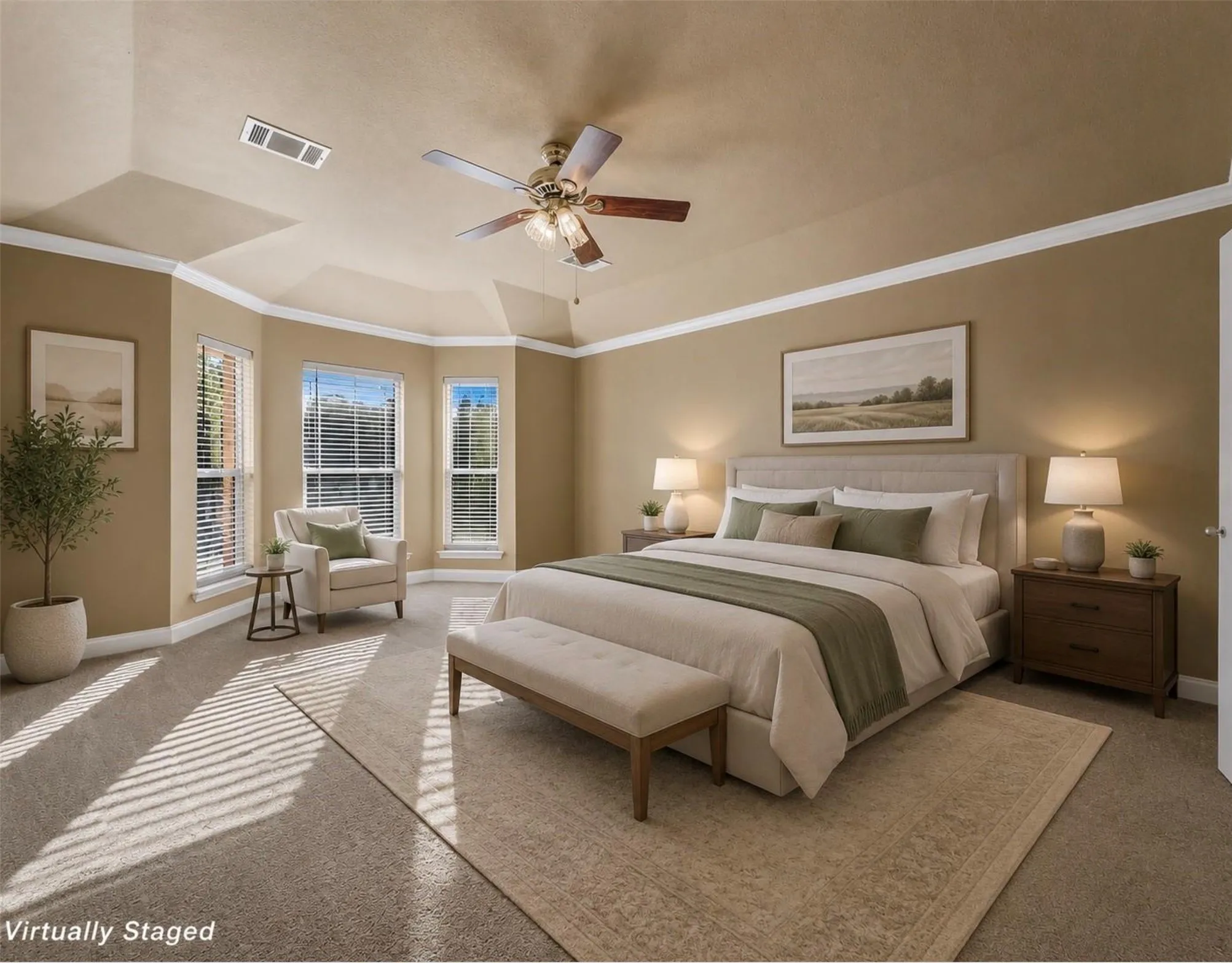 Tray ceiling with crown molding, ceiling fan, and bay window
