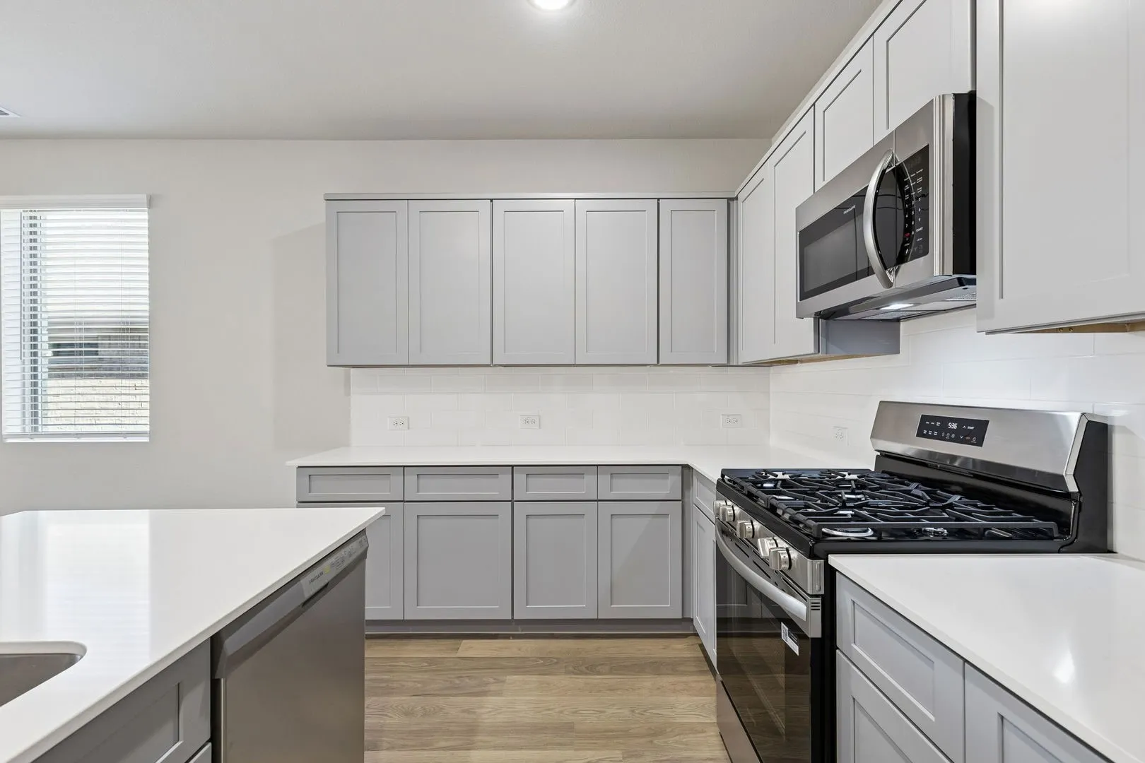 Kitchen in the Haylee home plan by Trophy Signature Homes - REPRESENTATIVE PHOTO