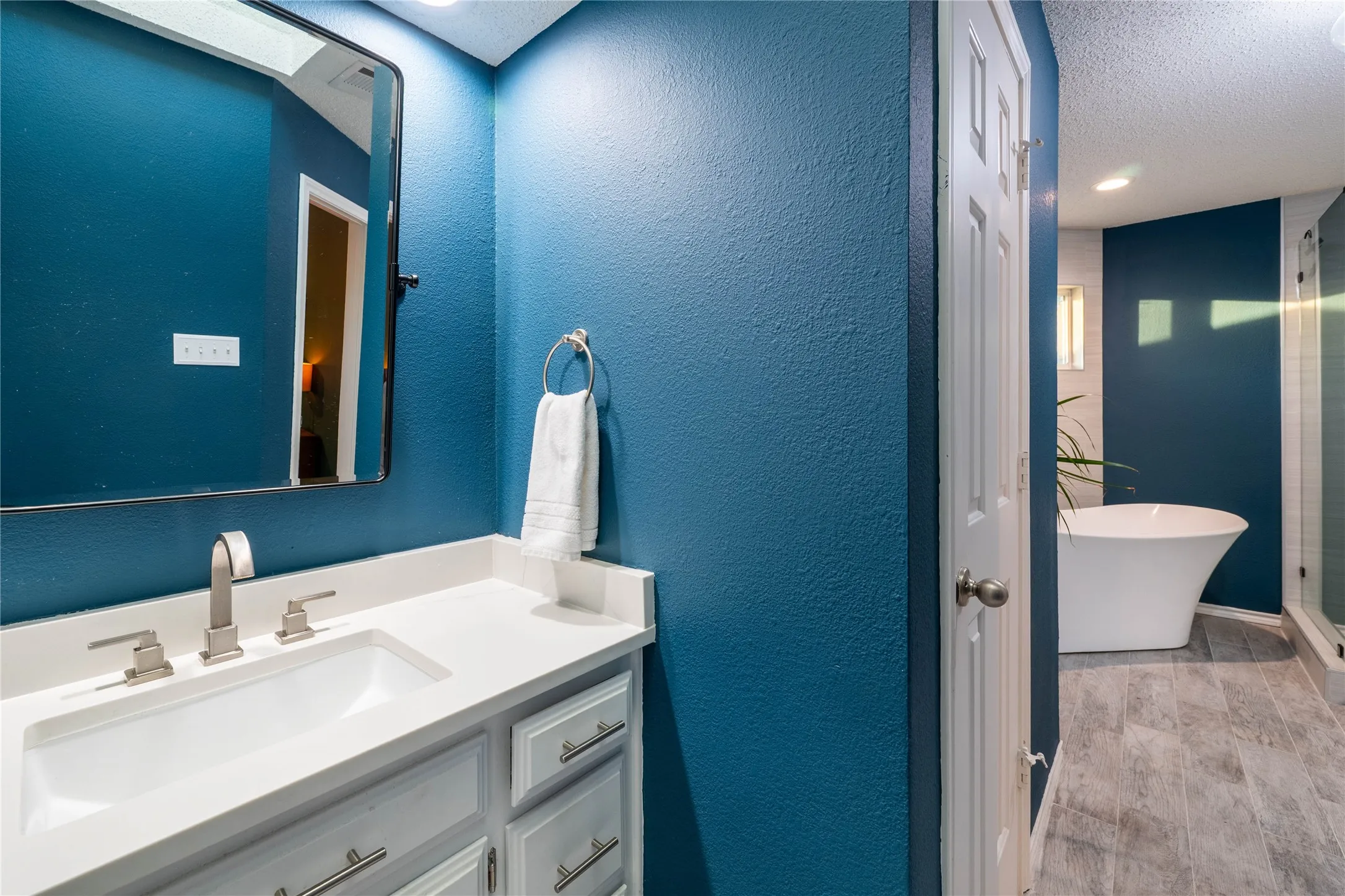 Contemporary vanity with an undermount sink and brushed nickel fixtures