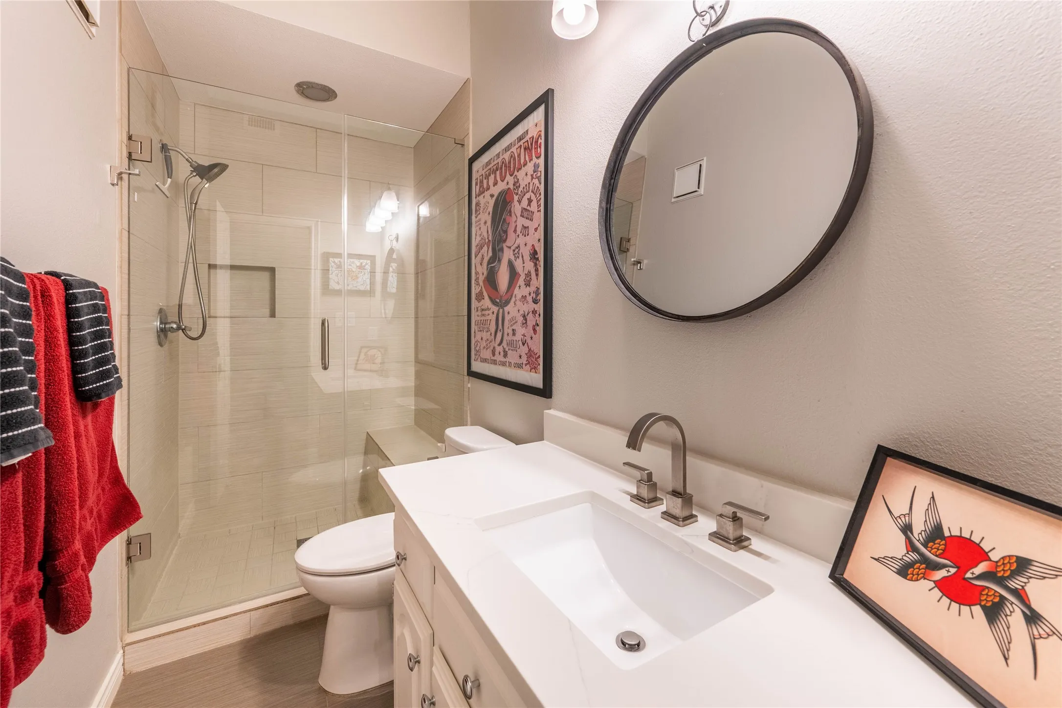 Walk-in shower with clear glass enclosure and integrated bench seating