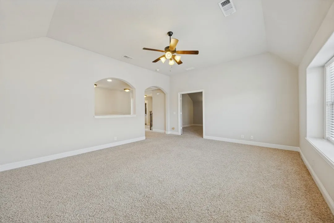 Vaulted ceiling with an attached ceiling fan