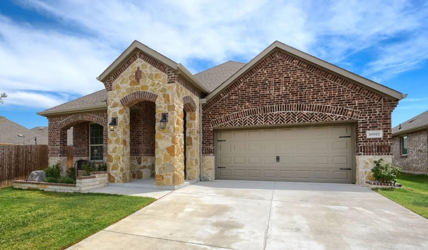 Brick and stone facade with arched entryways