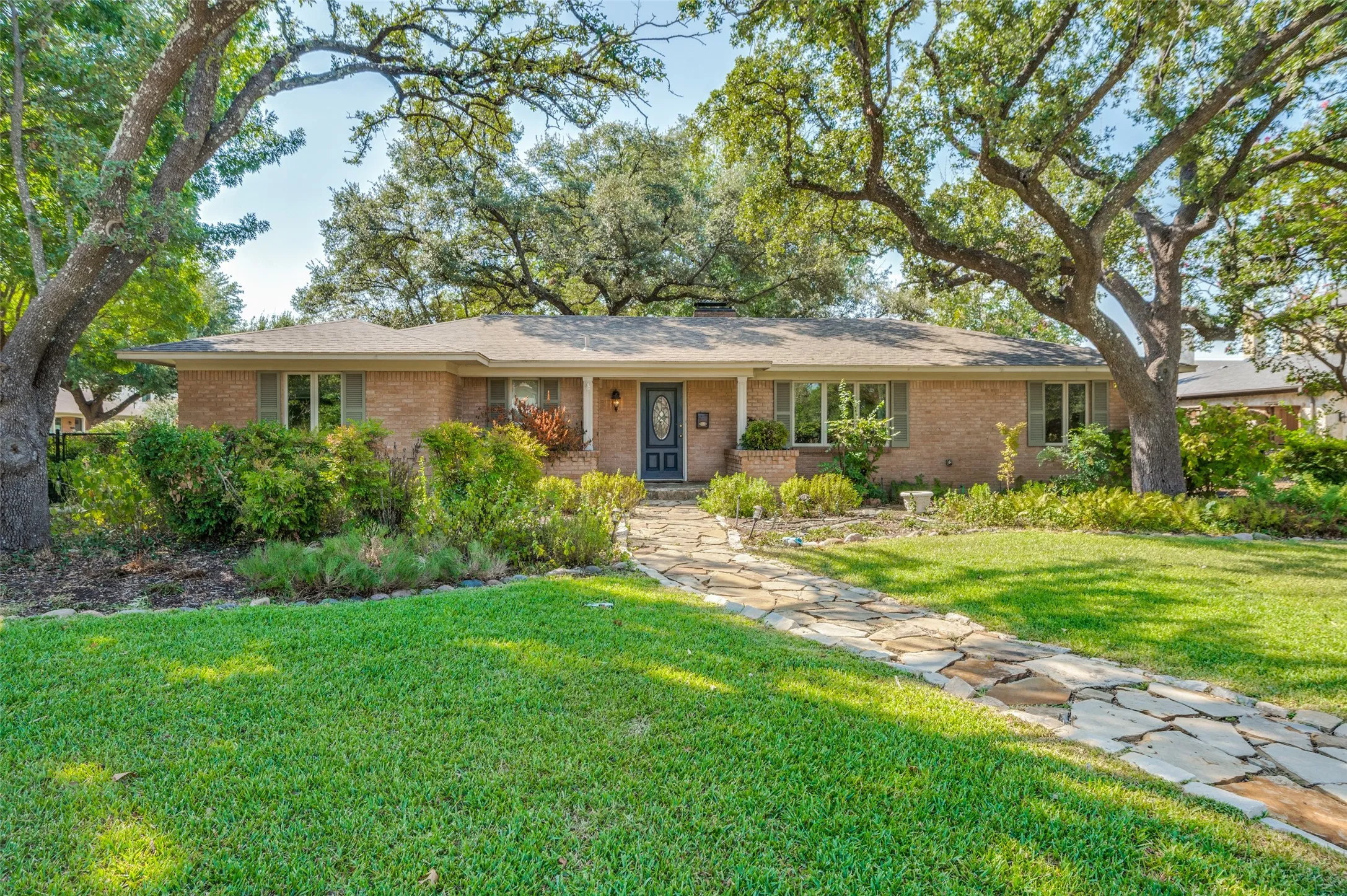 Brick exterior with a covered front entry