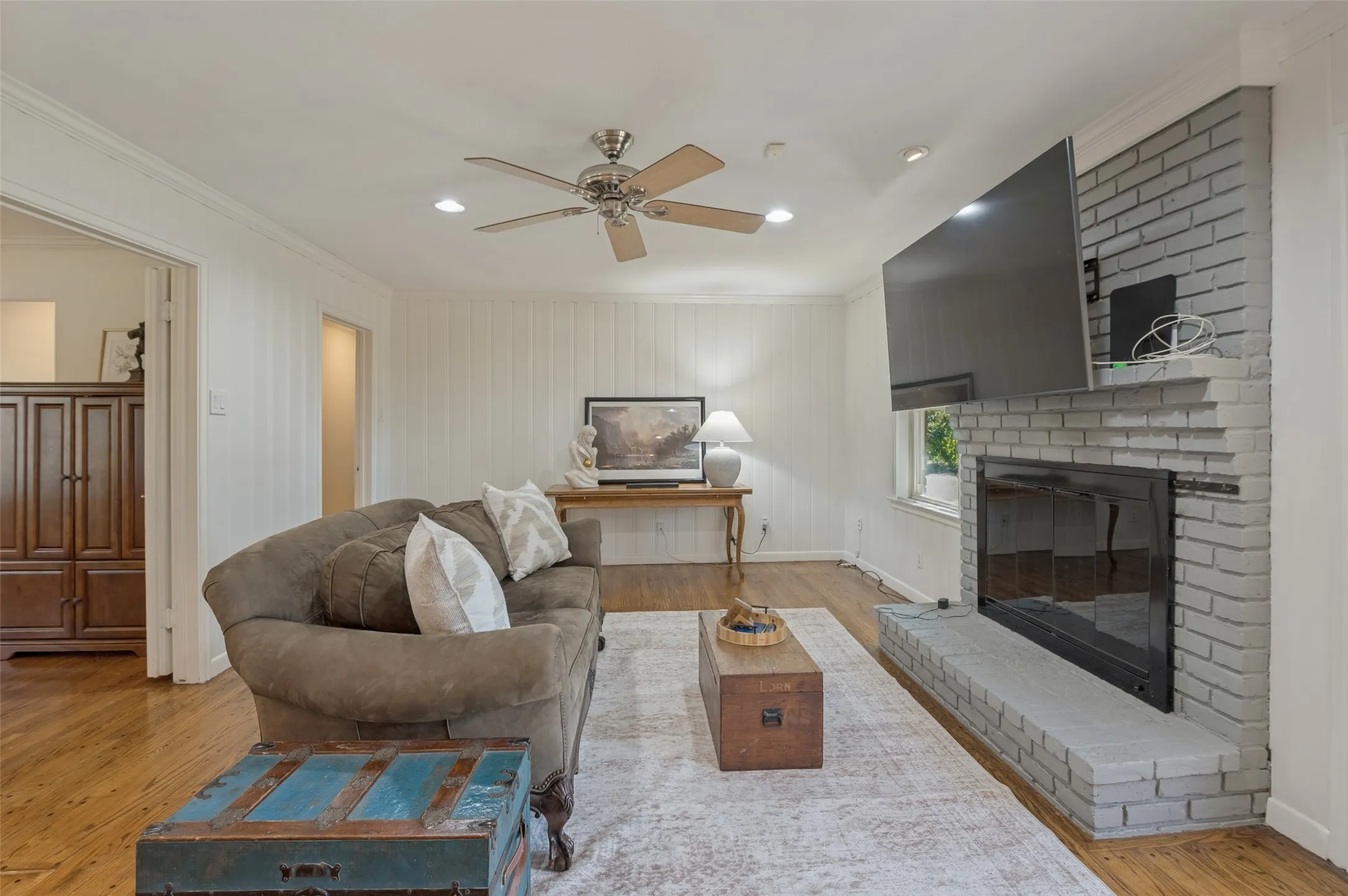 Light wood-finish flooring, recessed lighting, and a ceiling fan