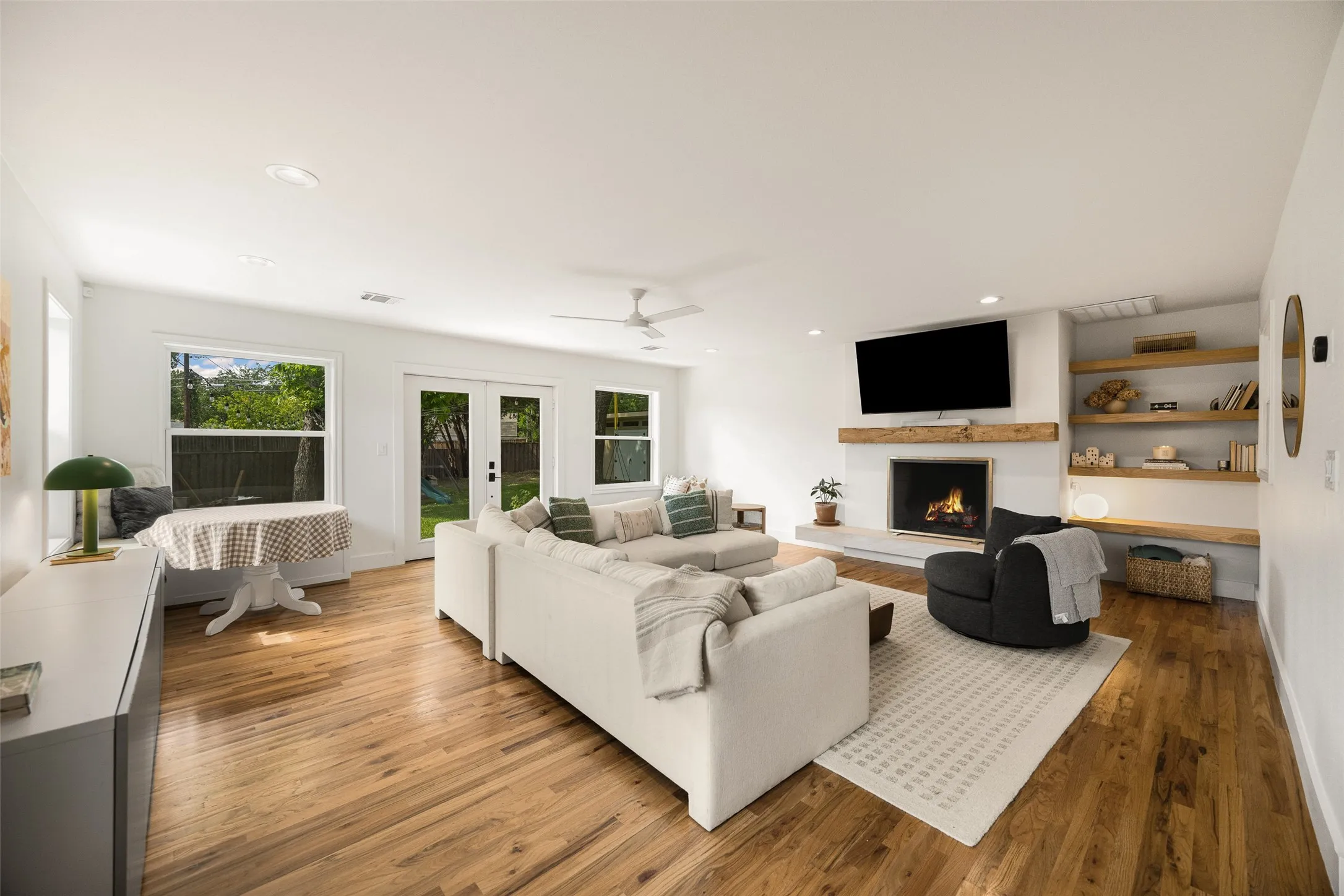 light-filled great room centered around a cozy fireplace.