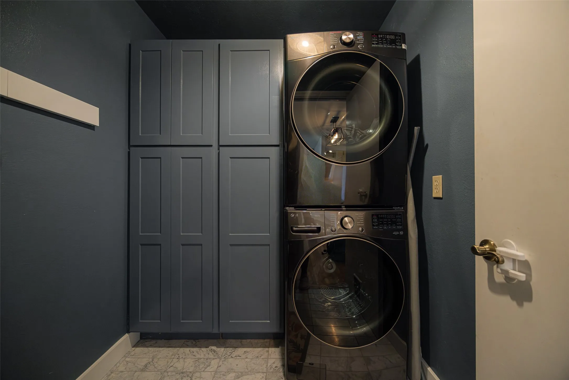 well appointed utility room with tons of storage