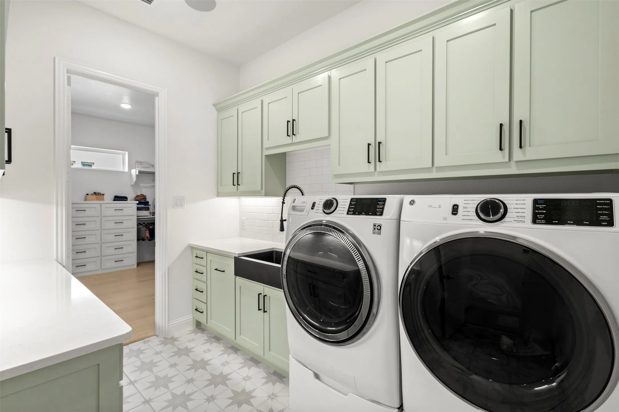 Laundry room with entrance from primary closet and Mud Room