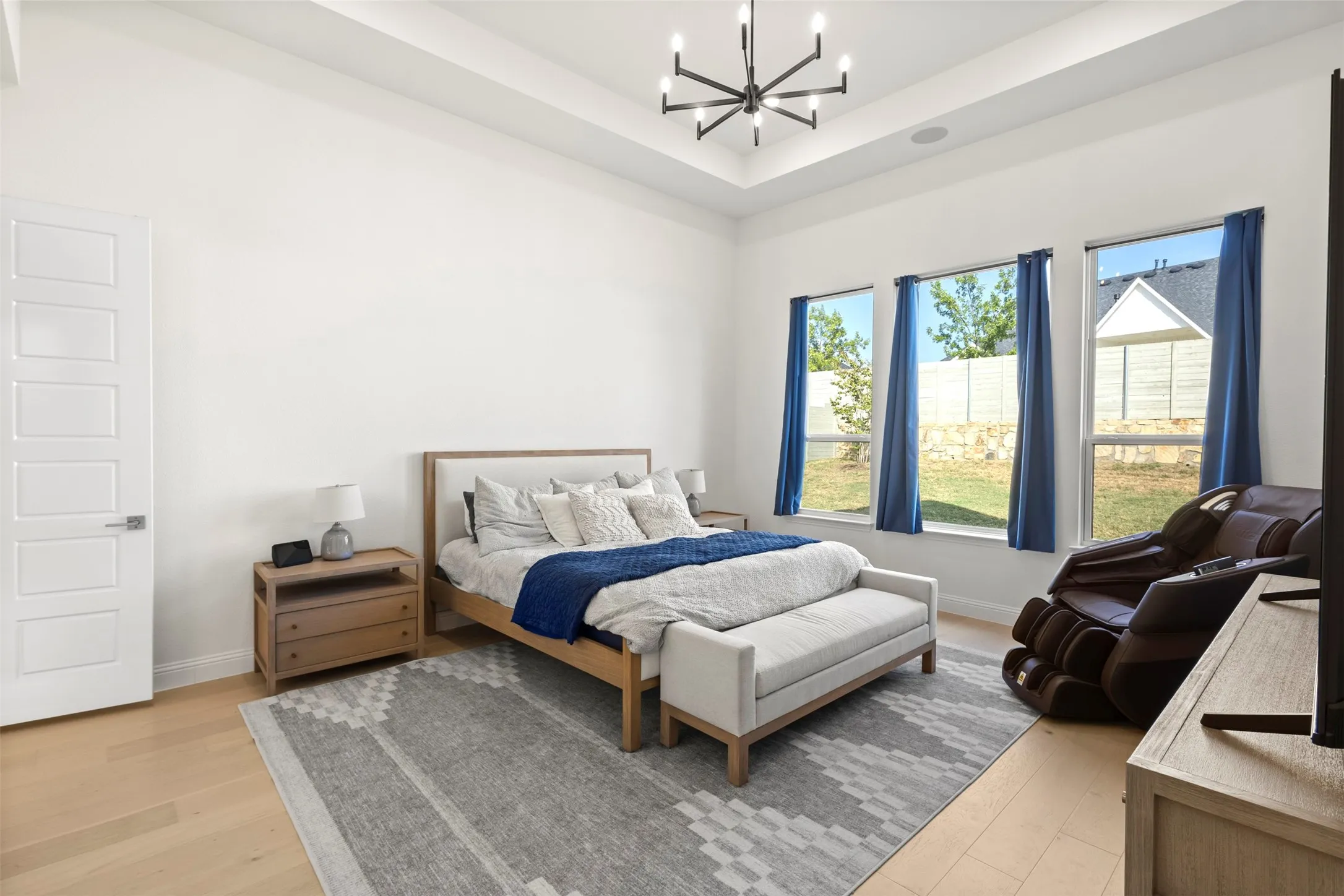 Primary Bedroom with windows looking to Backyard