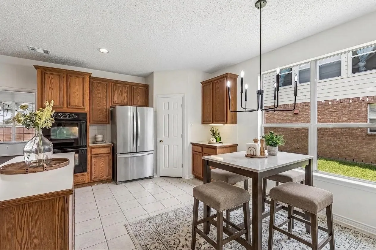 Spacious kitchen offers abundant cabinetry and workspace, plus gas already plumbed for future cooktop flexibility. *Virtually Staged*