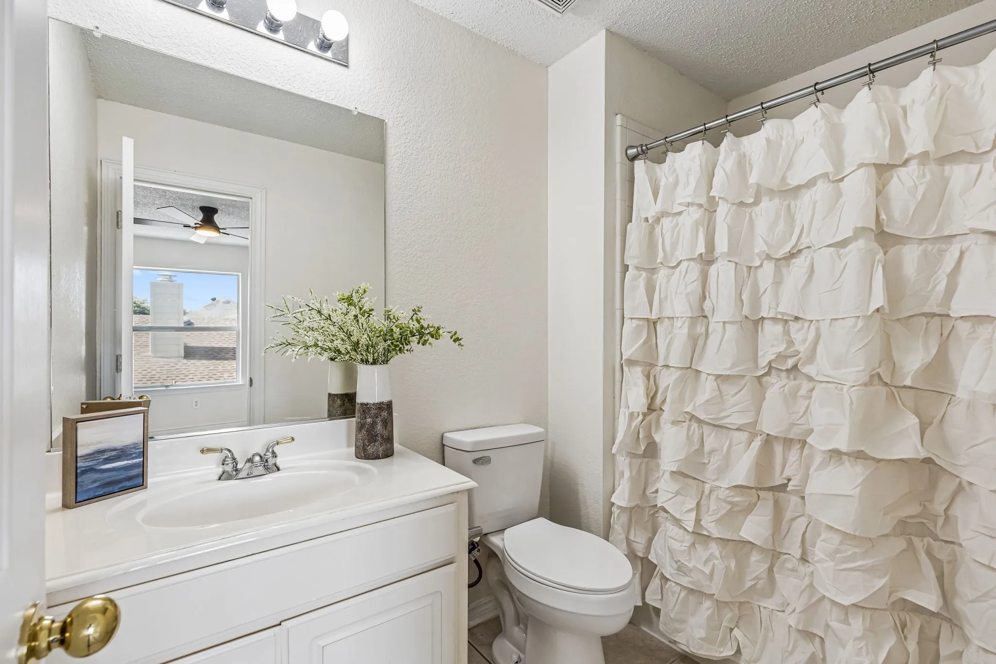 Private ensuite bath serves the spacious upstairs bedroom with oversized walk-in closet.