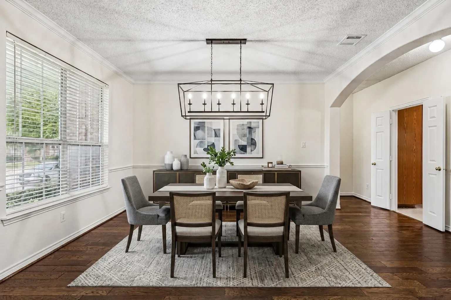 Natural light fills the dining room, conveniently positioned near the kitchen and main living spaces. *Virtually Staged*