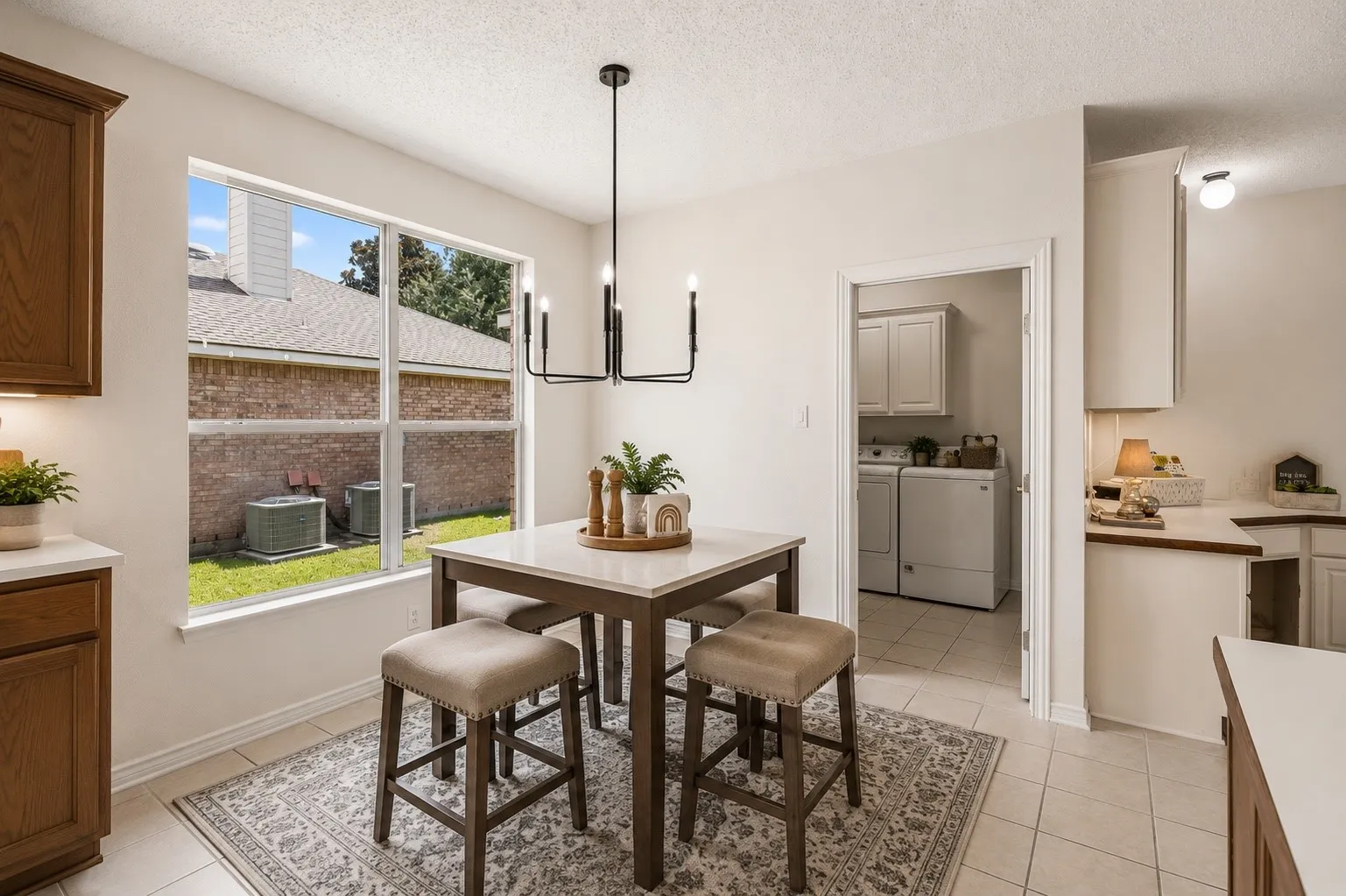 Light-filled breakfast nook provides casual dining space conveniently located between the kitchen and family room. *Virtually Staged*