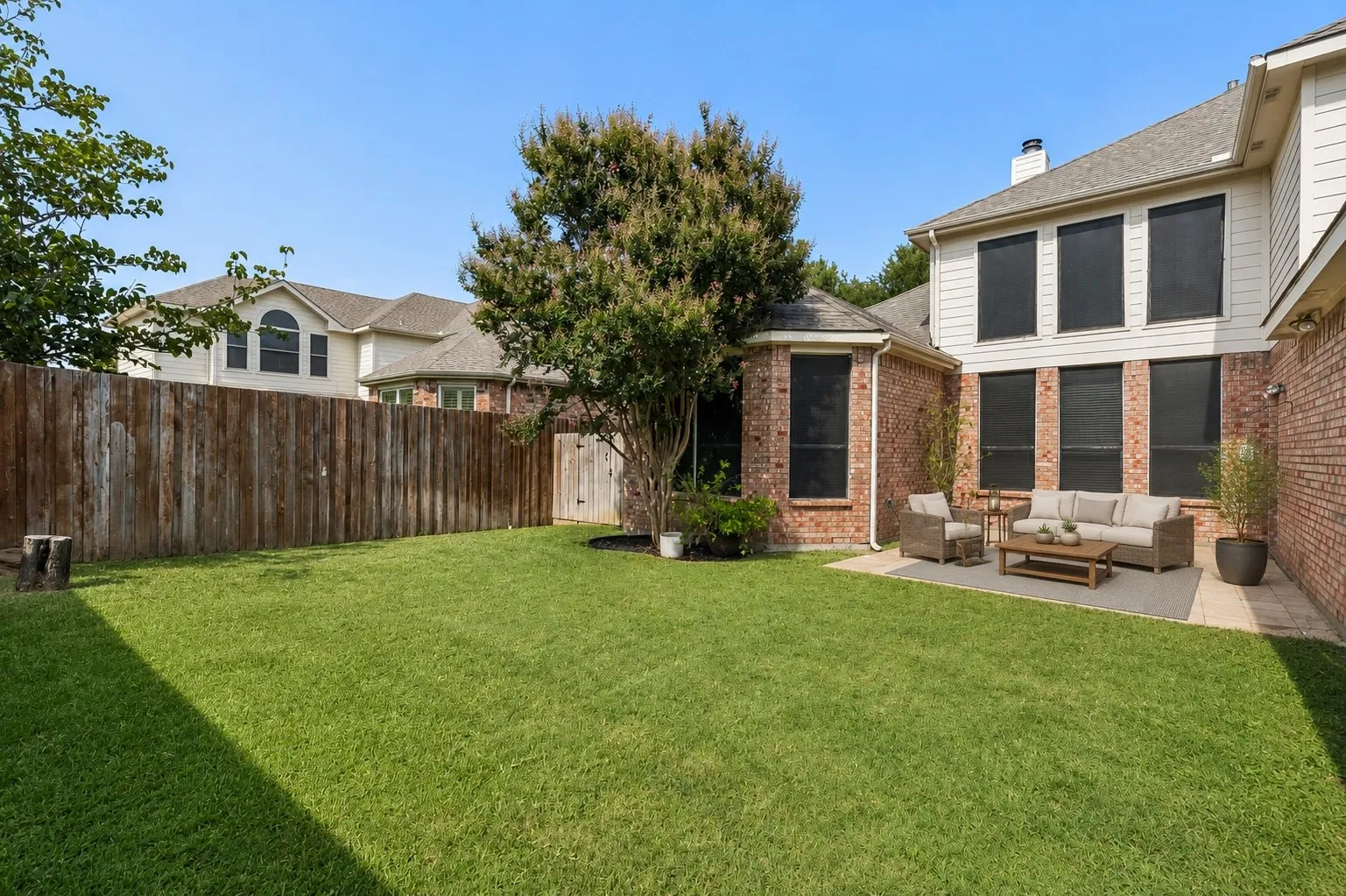 Spacious backyard offers a grassy lawn with room to play, relax or personalize the outdoor space. *Virtually Staged*