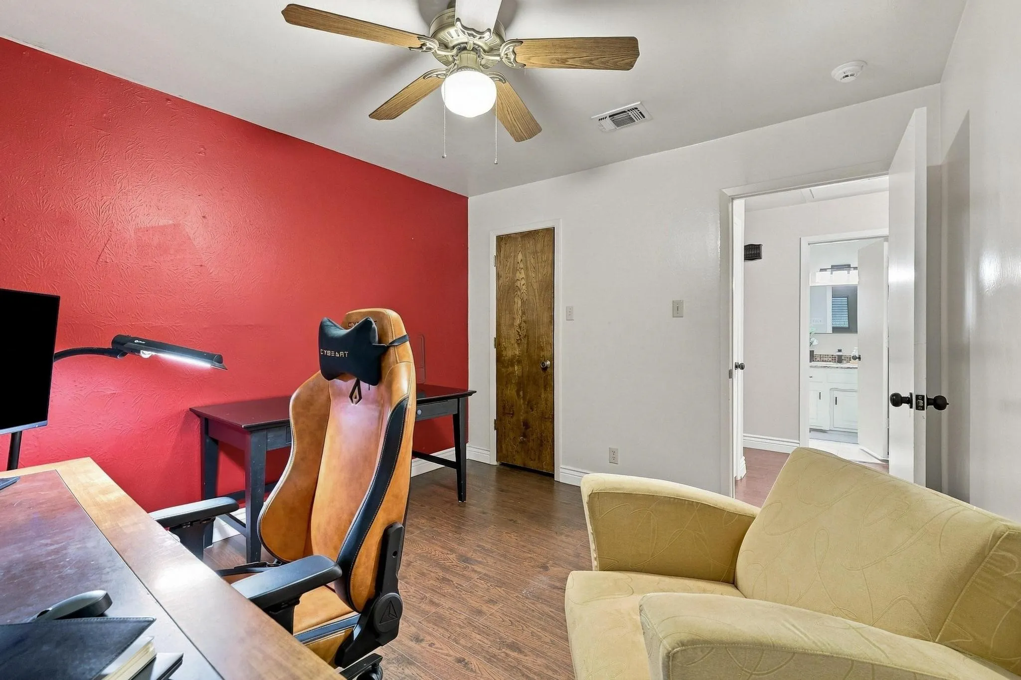 Wood-finish flooring, ceiling fan, and a solid core door