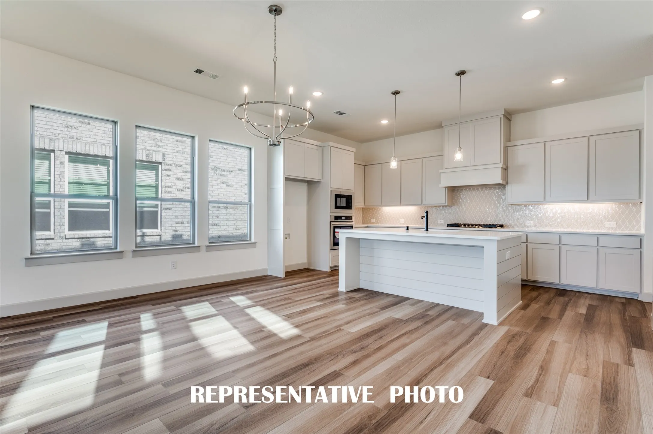 Whether it's lively dinner parties or cozy family gatherings, this light filled dining room fits all occasions!  REPRESENTATIVE PHOTO