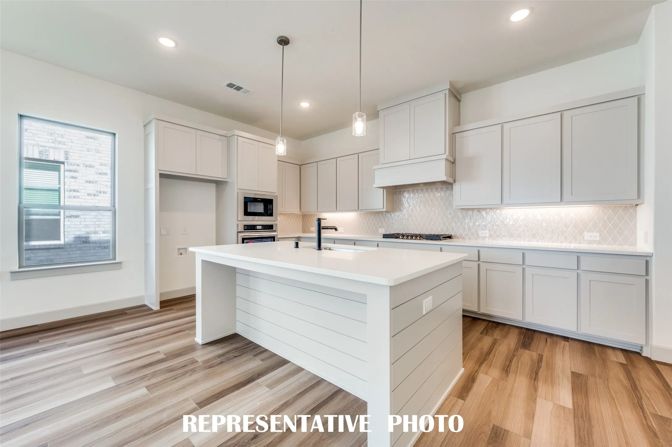 With ample storage and prep space, all the chef's in the family will love creating culinary masterpieces in this dream kitchen!  REPRESENTATIVE PHOTO