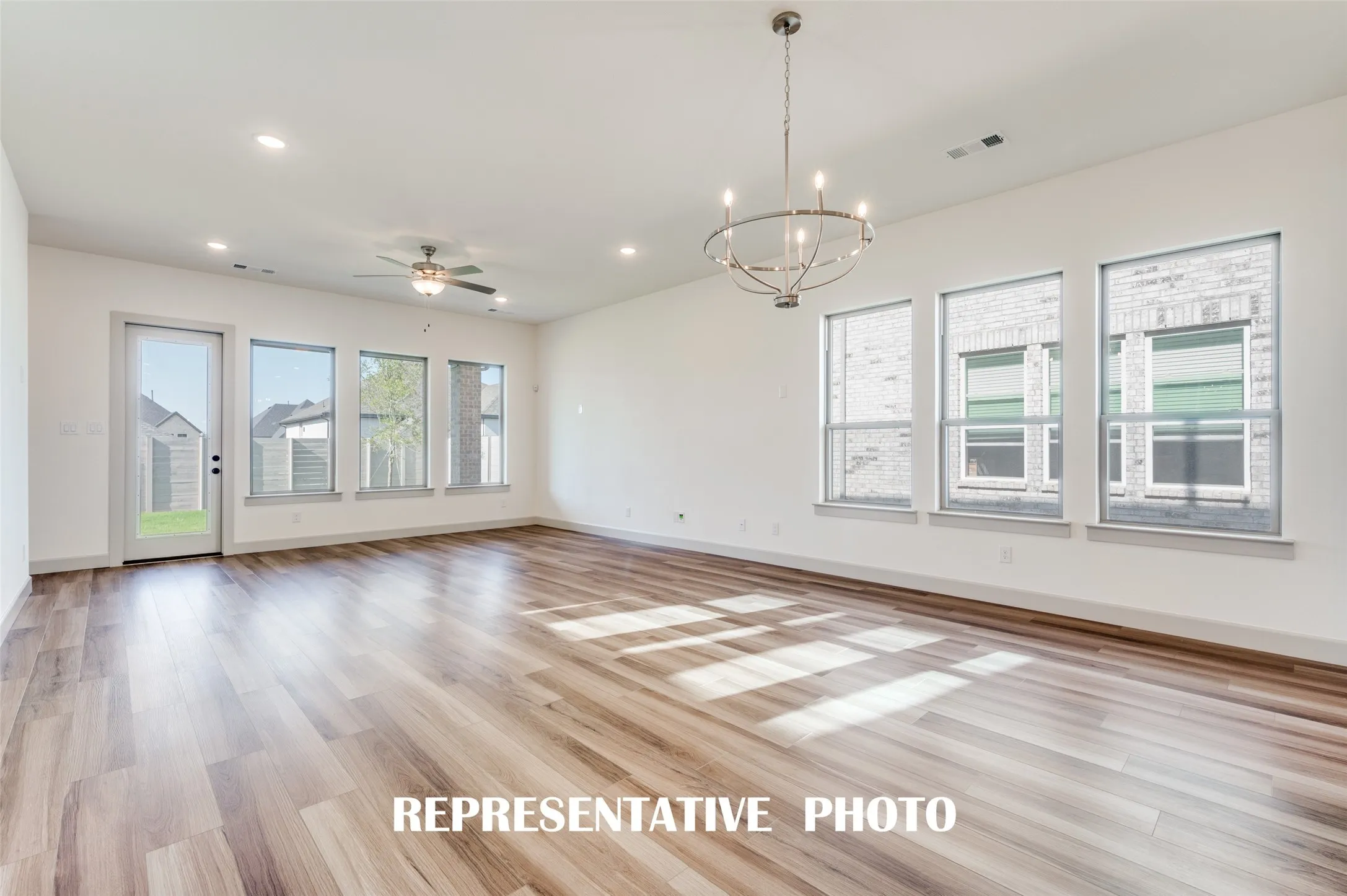 With the dining and family rooms open to the kitchen, you'll enjoy effortless entertaining in our Brice plan.  REPRESENTATIVE PHOTO