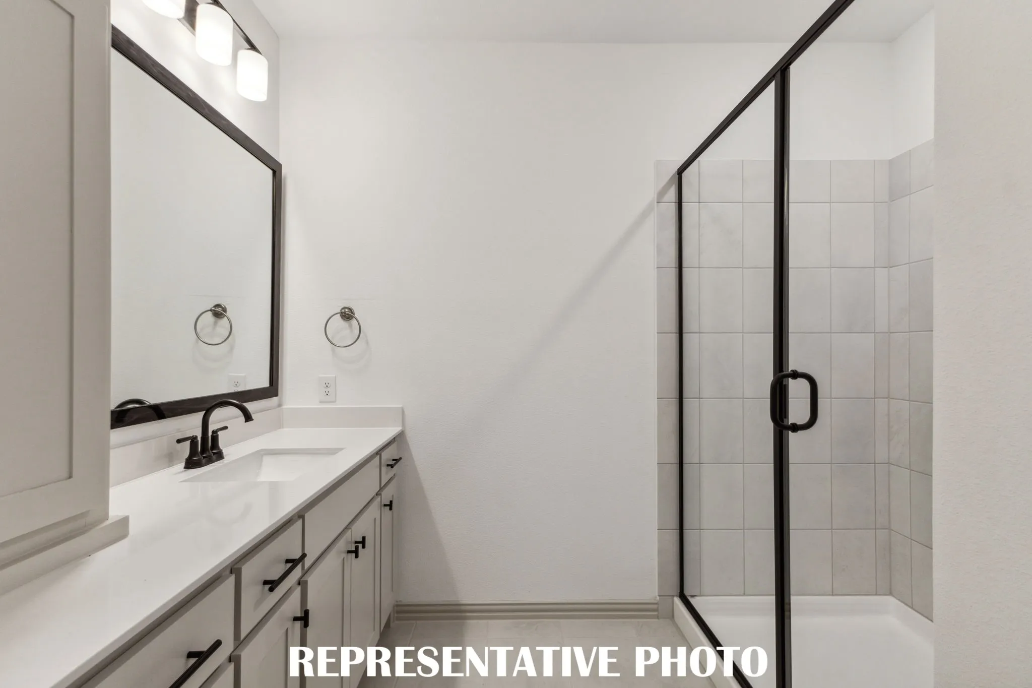 Featuring an oversized walk in shower, this owner's bath is the perfect place to start or end your day!  REPRESENTATIVE PHOTO