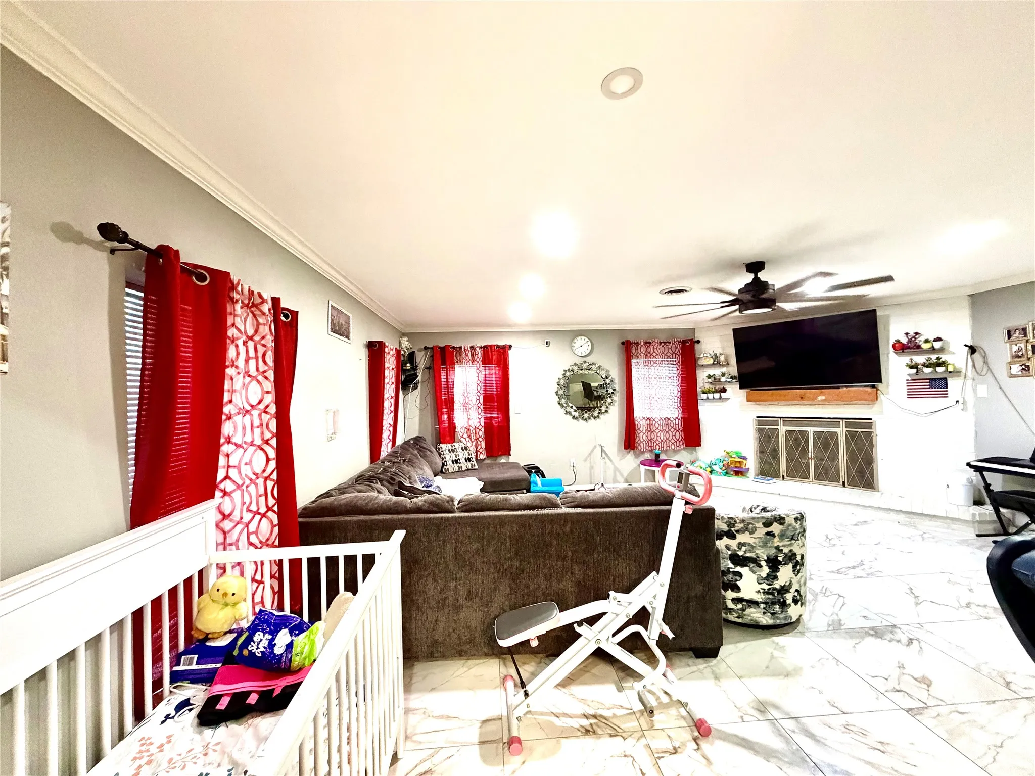 Spacious interior featuring a tiled floor, recessed lighting, and crown molding