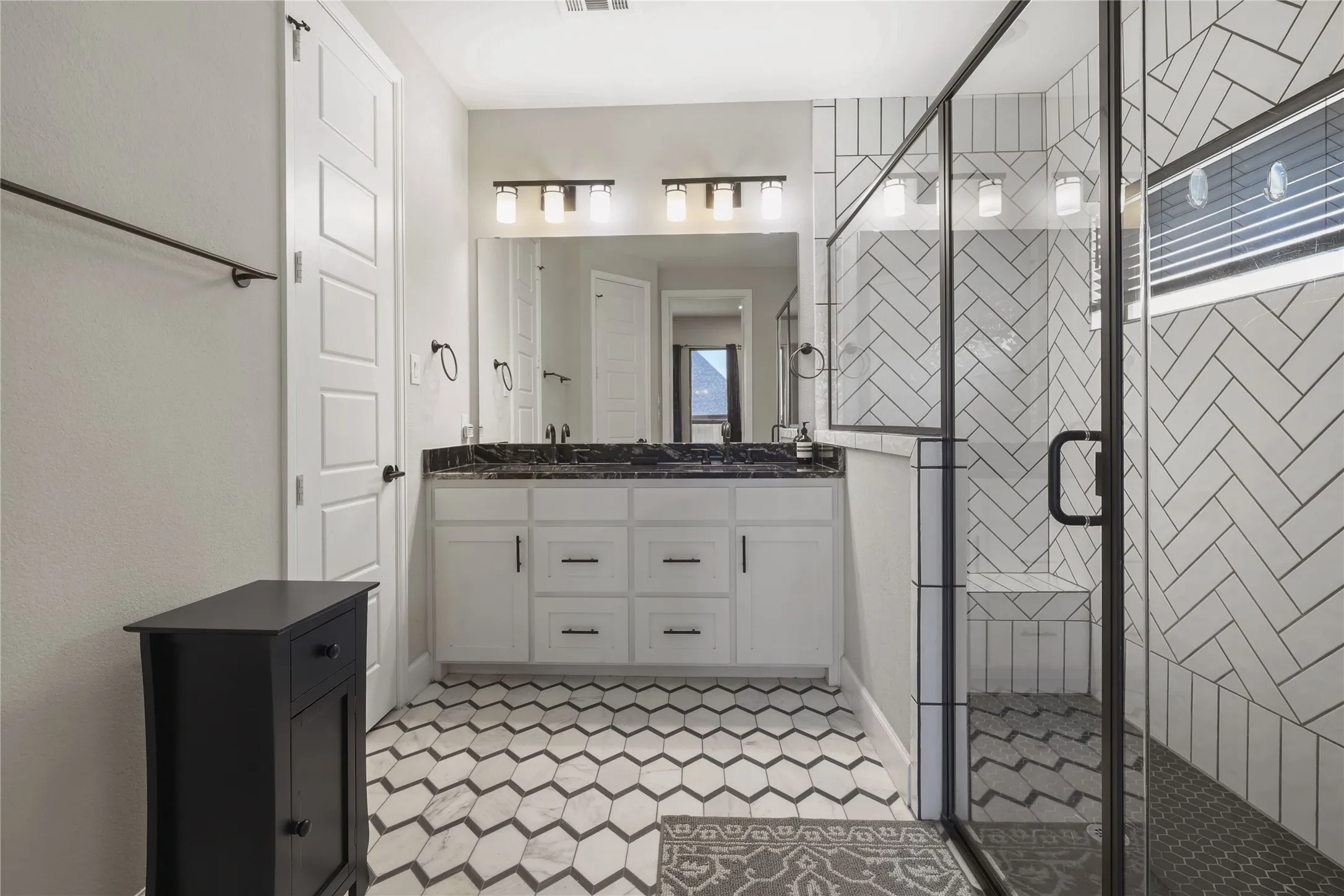 Dual sink vanity with dark countertop