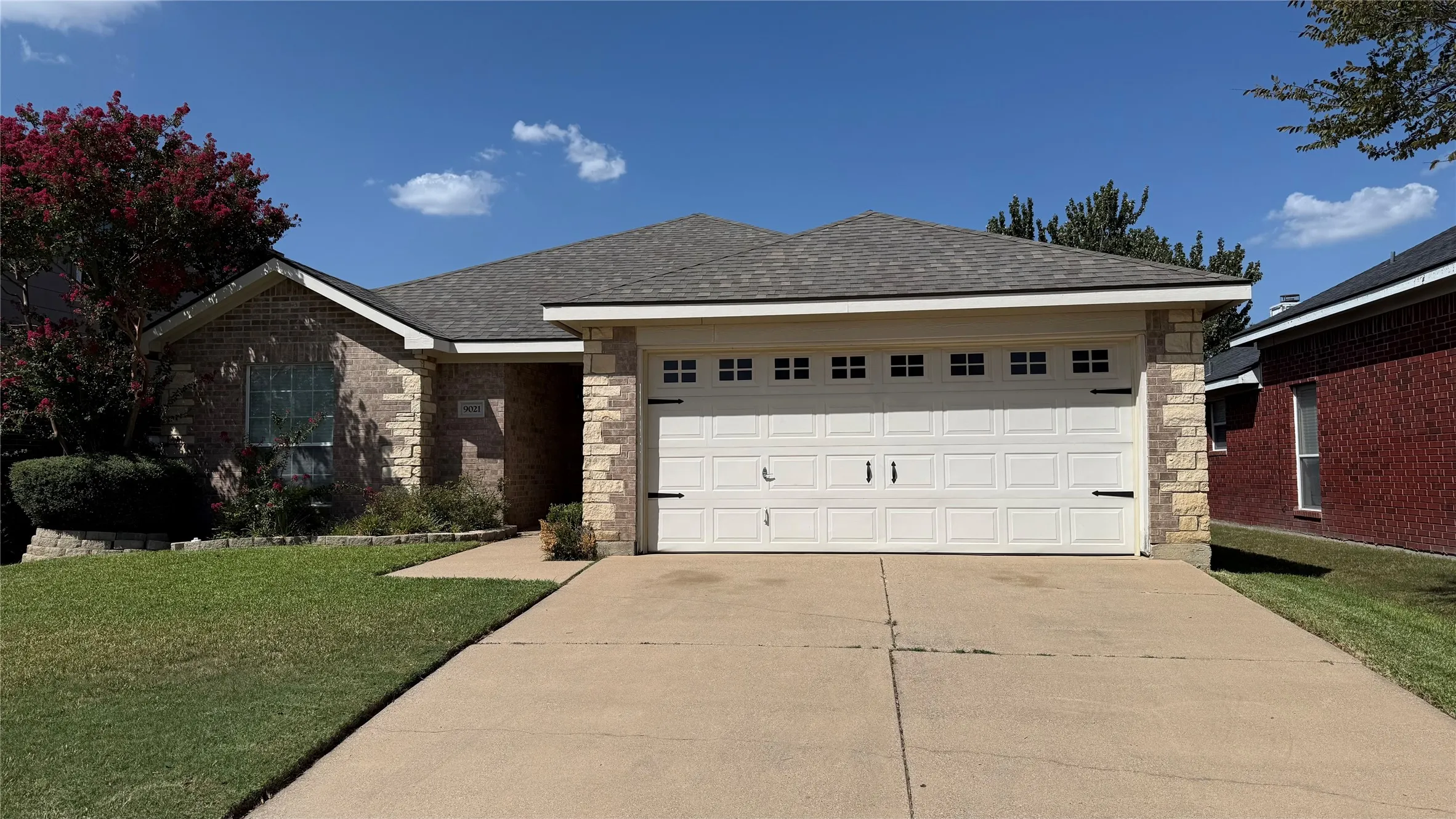 Stone and brick veneer exterior with a gabled roof