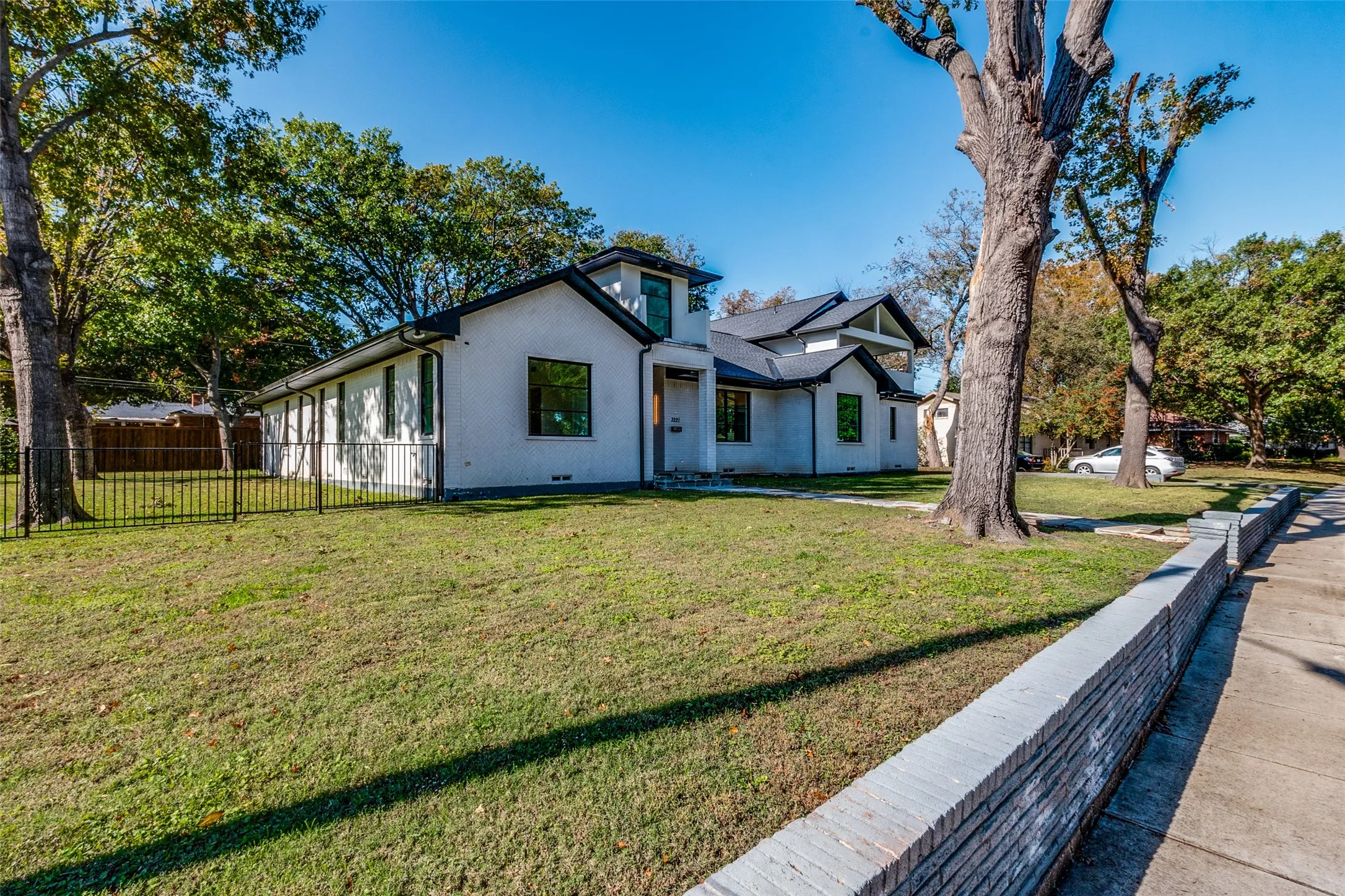 White exterior with dark trim and black-framed windows